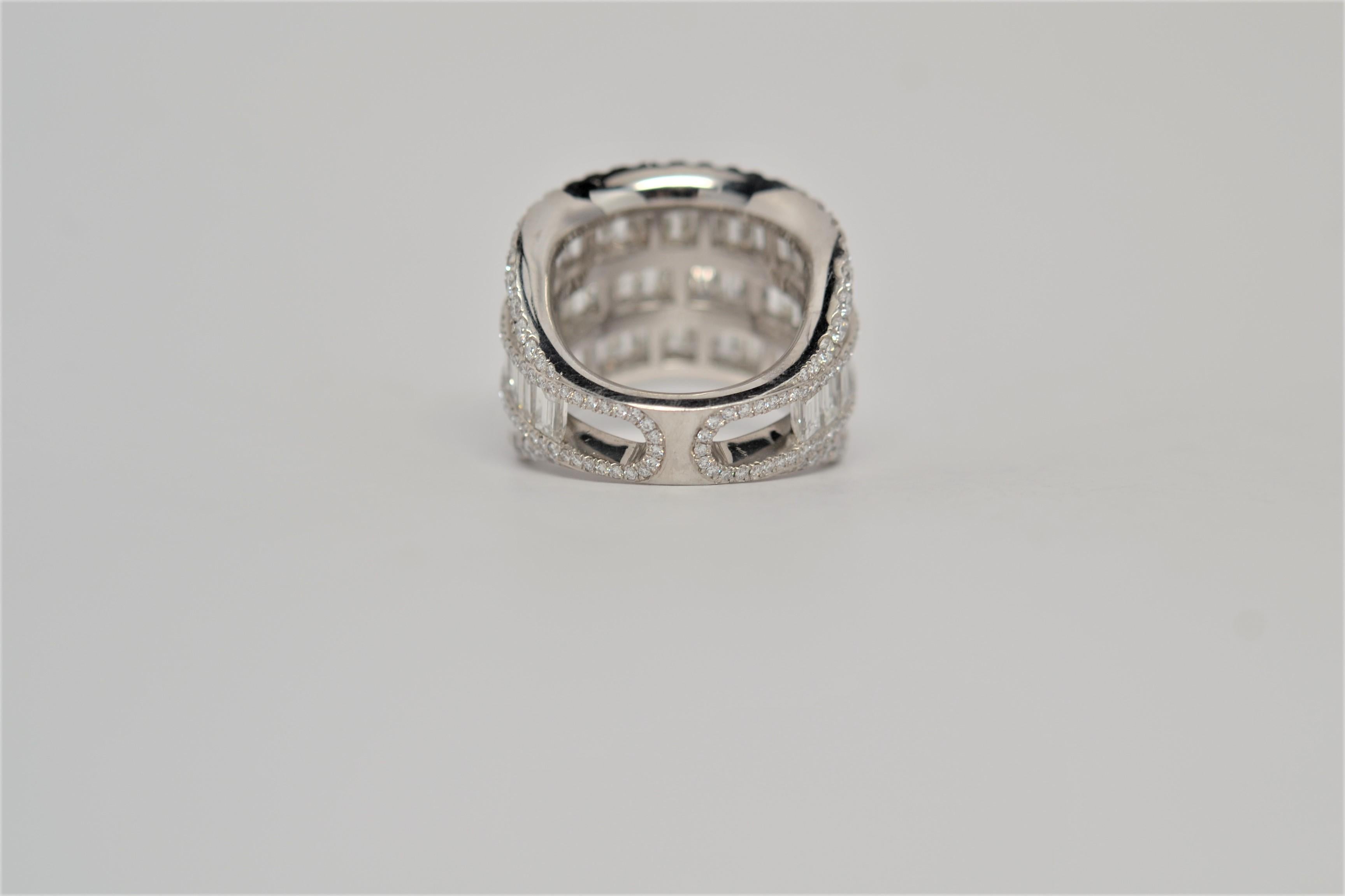 A finely made ladies' Platinum and Diamond wedding band set in an eternity format with both Round Brilliant and Baguette Cut Diamonds. A seven row layout is set with alternating diamond cuts and tapers to a single row. Two hundred and eight Round