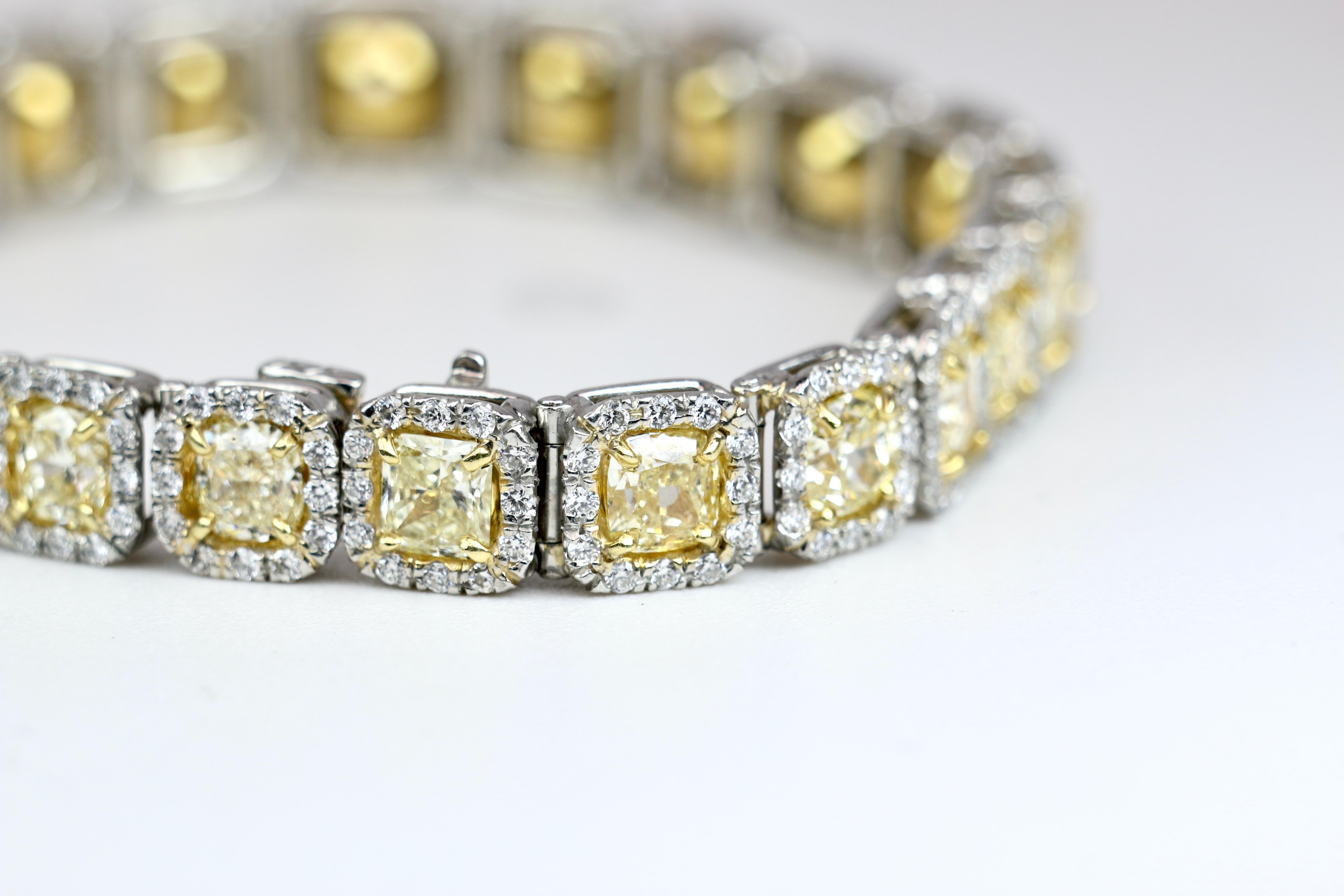 Platinum White Gold Diamond Bracelet with lively Yellow Diamonds.  This phenomenal bracelet is a classic lighting up your wrist and your night!
18K Yellow Diamond bracelet with 18.24 CTW Yellow Diamonds and 3.36 CTW White Diamonds 
Length is 7.5