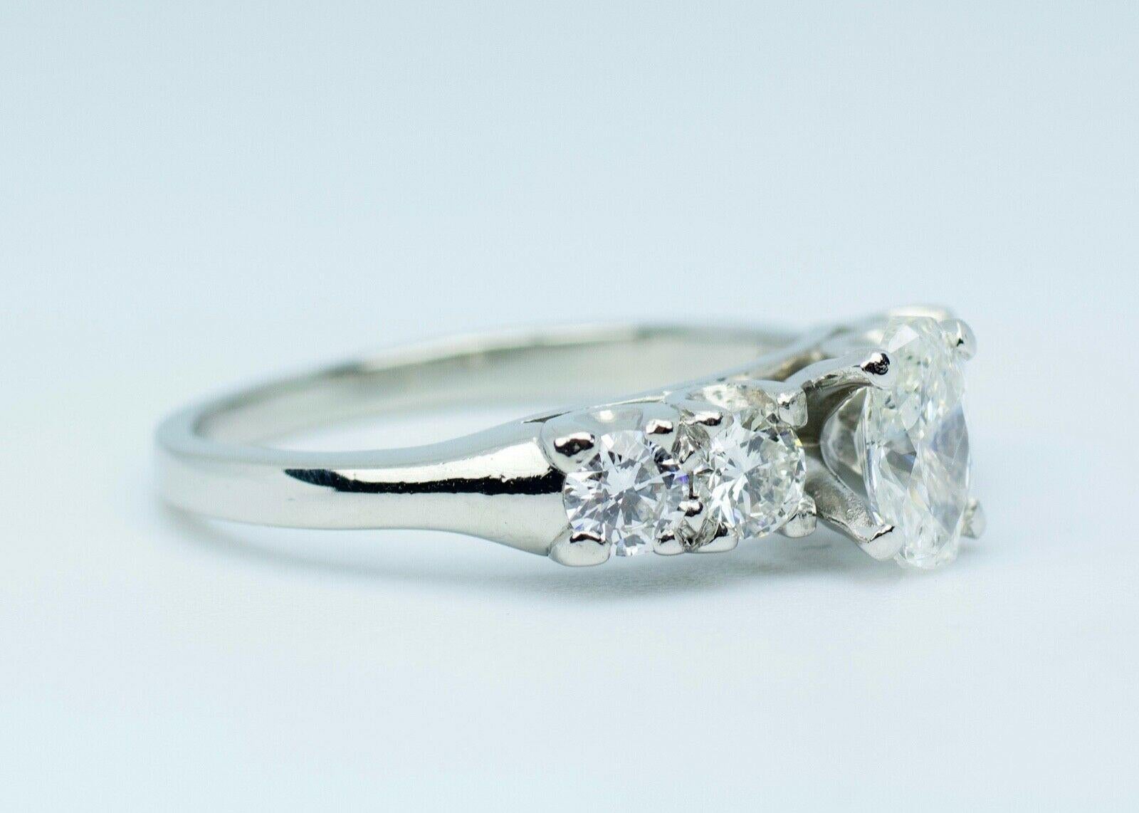 Platinum White Oval Diamond Center with Round White Diamond Ring 1