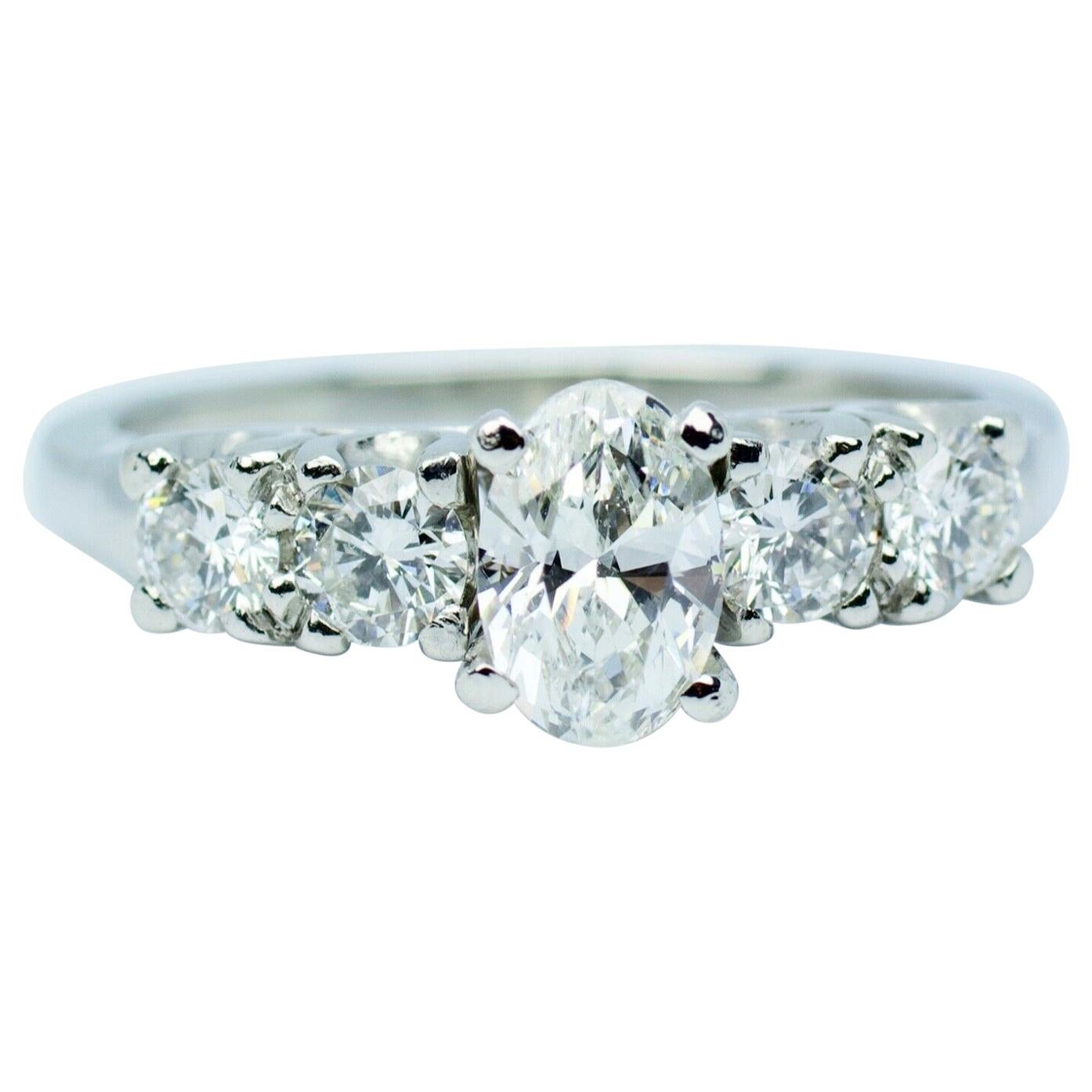 Platinum White Oval Diamond Center with Round White Diamond Ring