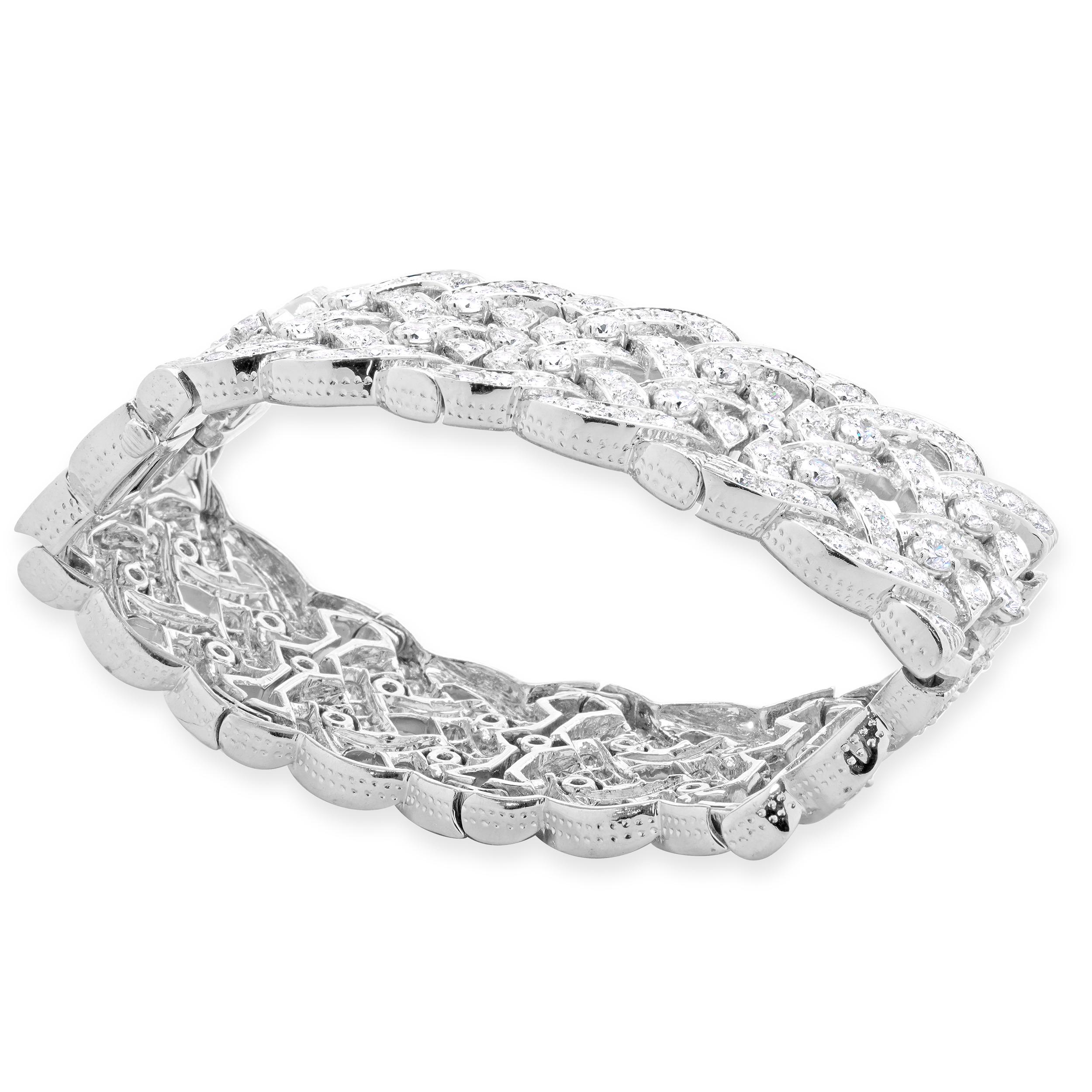 Designer: custom design
Material: platinum
Diamond: 422 round brilliant diamonds= 30.00cttw
Color: G / H
Clarity: VS-SI1
Dimensions: bracelet will fit up to a 6-inch wrist
Weight: 141 grams
