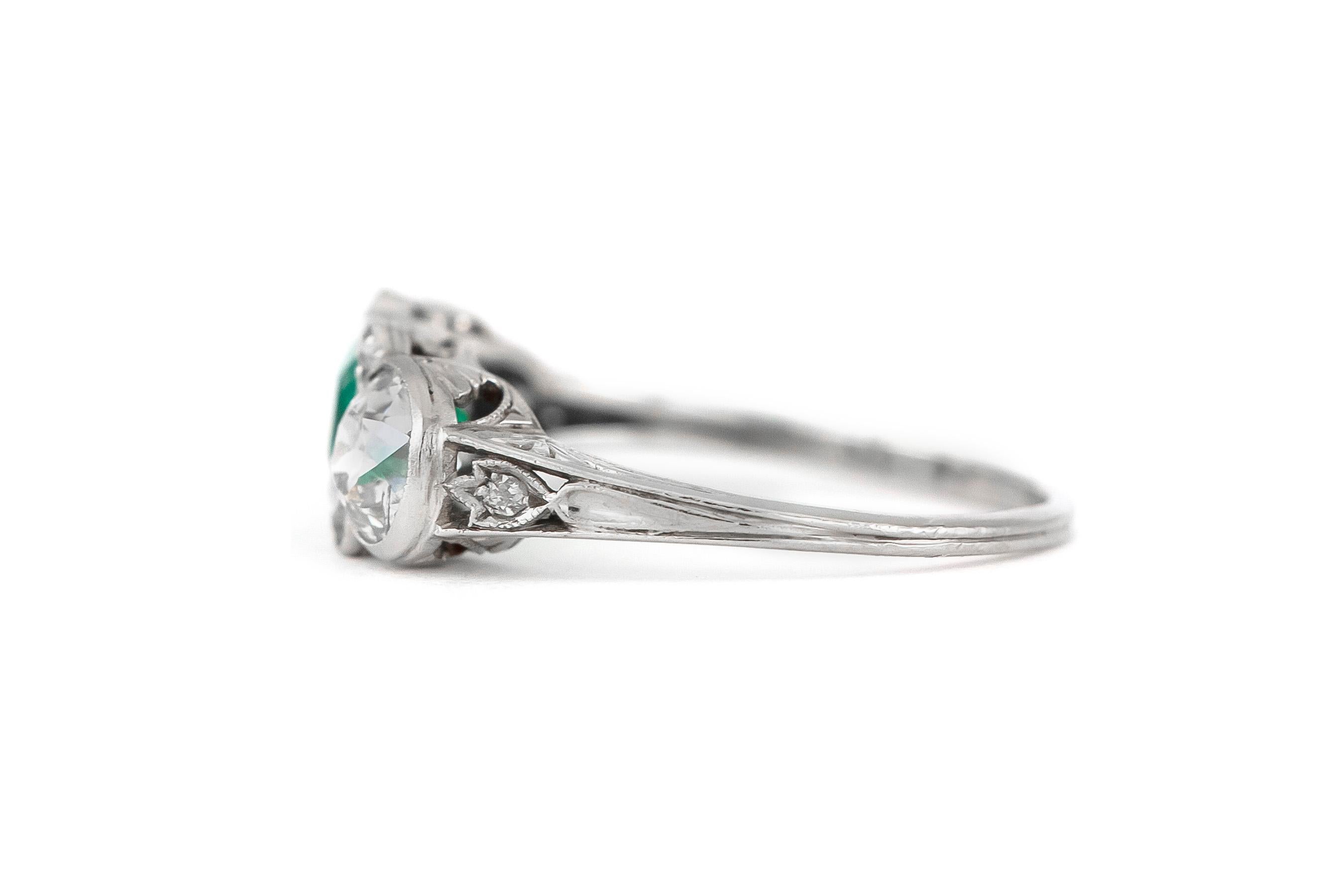 Round Cut Platinum with Center Emerald Engagement Ring