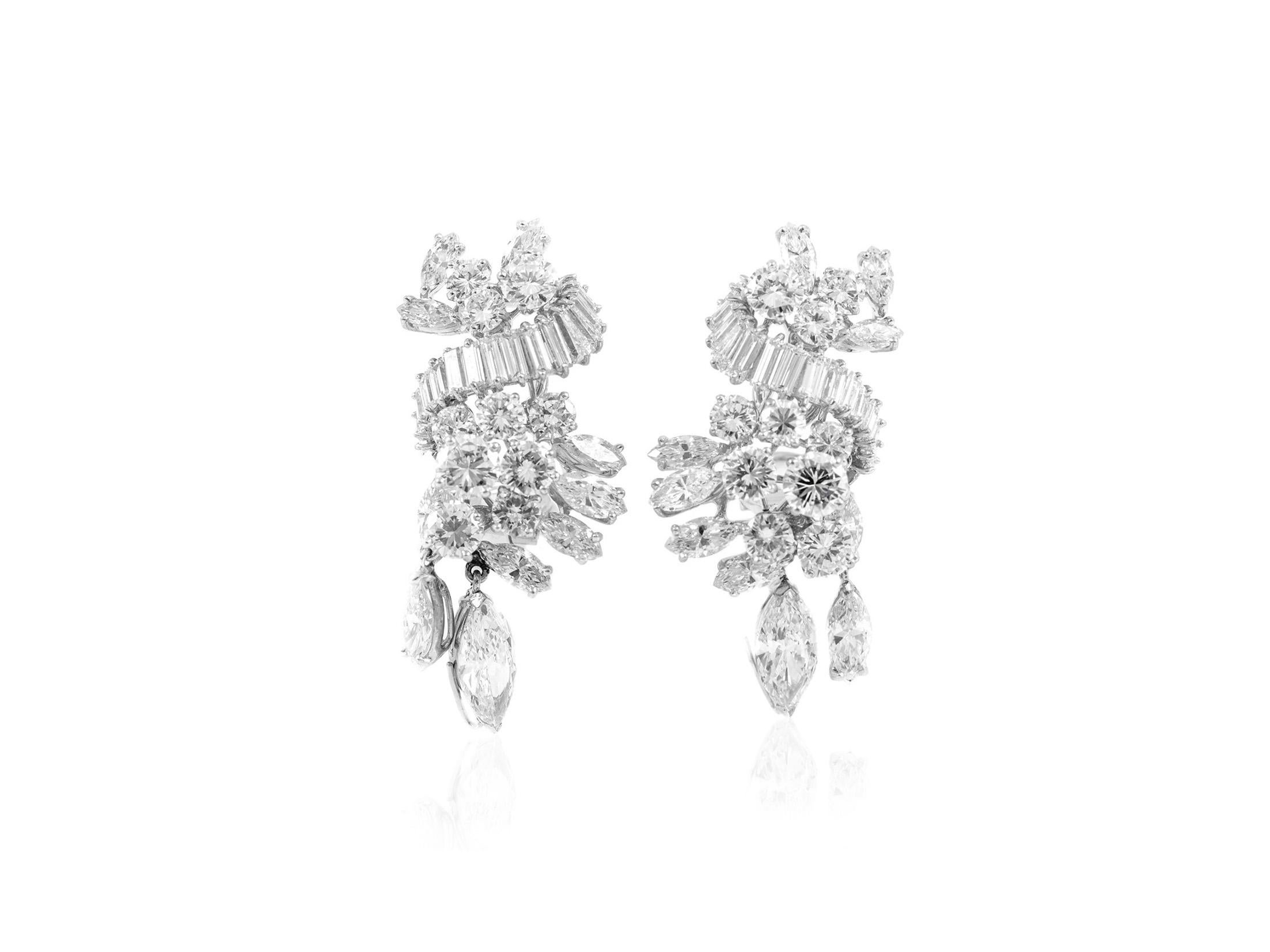 The earrings are finely crafted in platinum with 1.34 carat Gia marquise . Color F Clarity VVS1.
With 1.39 Gia Marquise . Color D Clarity  VS1  and all around eighing approximately total of 15.00 carta.