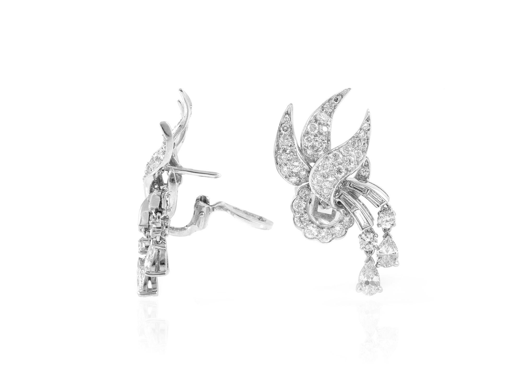 The earrings are finely crafted in platinum with round and pear shape that weighing approximately total of 5.00 carat.