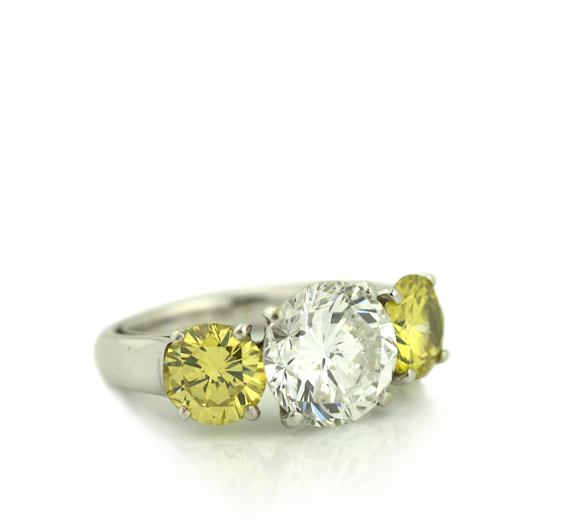 Round Cut Platinum, Yellow Diamond and Diamond Three Stone Engagement Ring For Sale