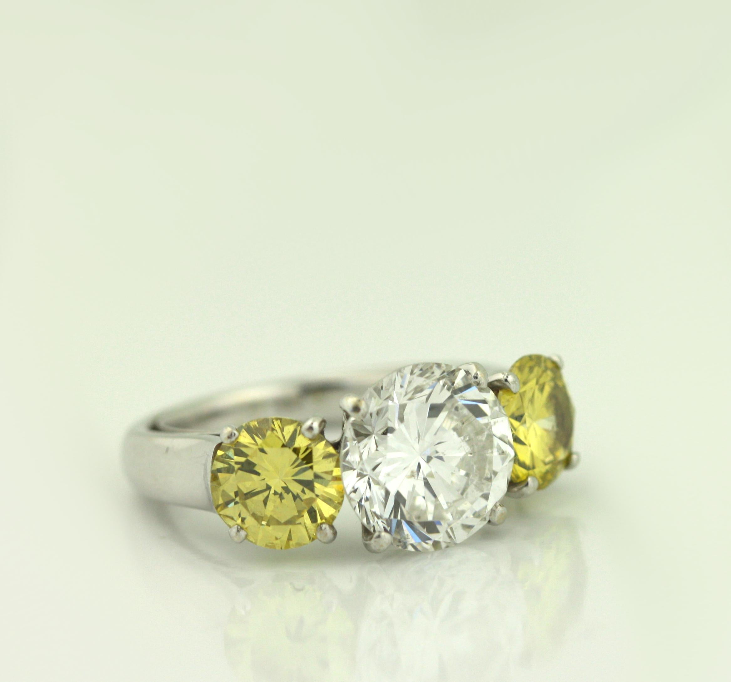 Platinum, Yellow Diamond and Diamond Three Stone Engagement Ring For Sale 2