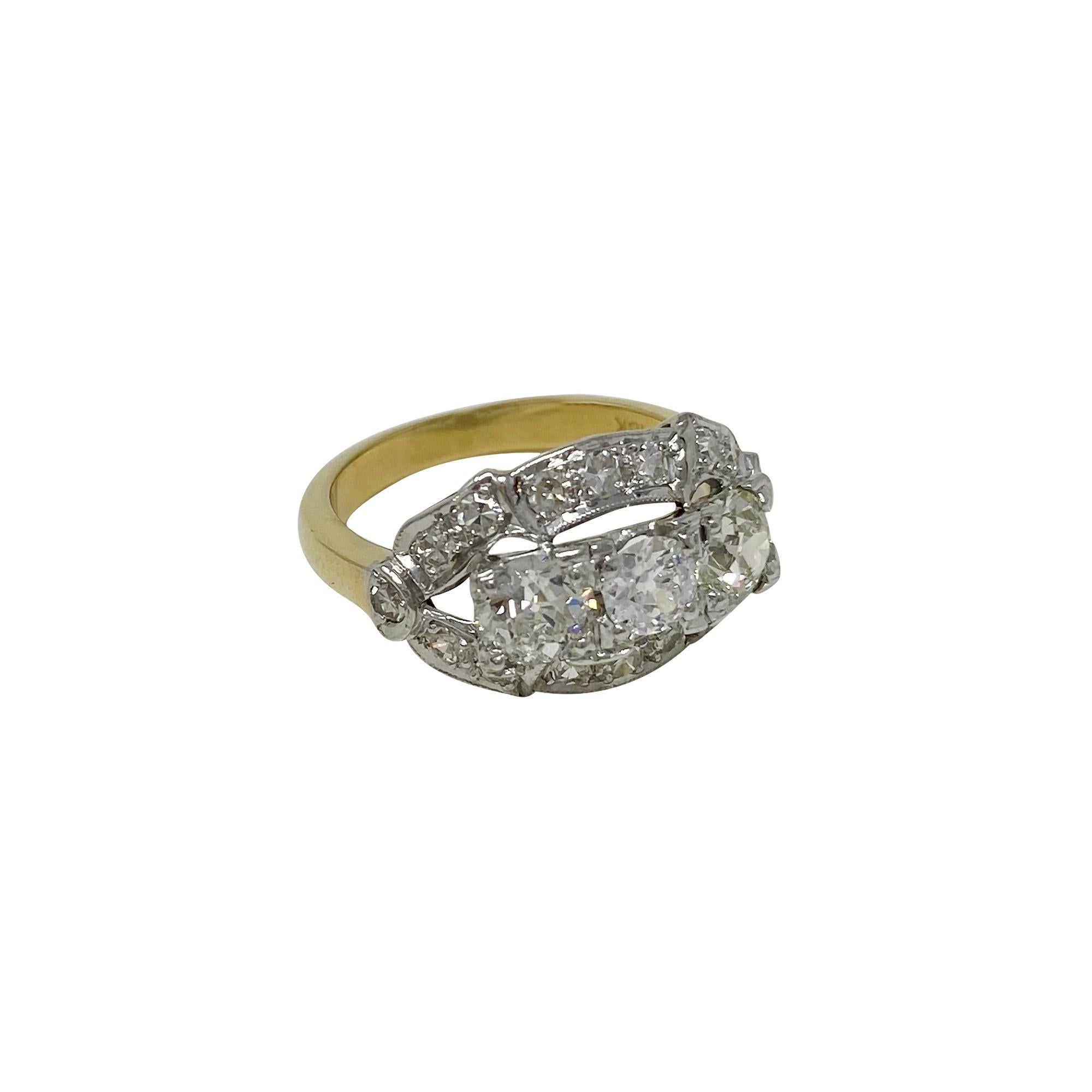 The sparkle on this lovely ring is stunning!  With 1.45 carats of diamonds, in platinum with a yellow gold shank, this beauty supports old European-cut and single-cut diamonds. Size 6.