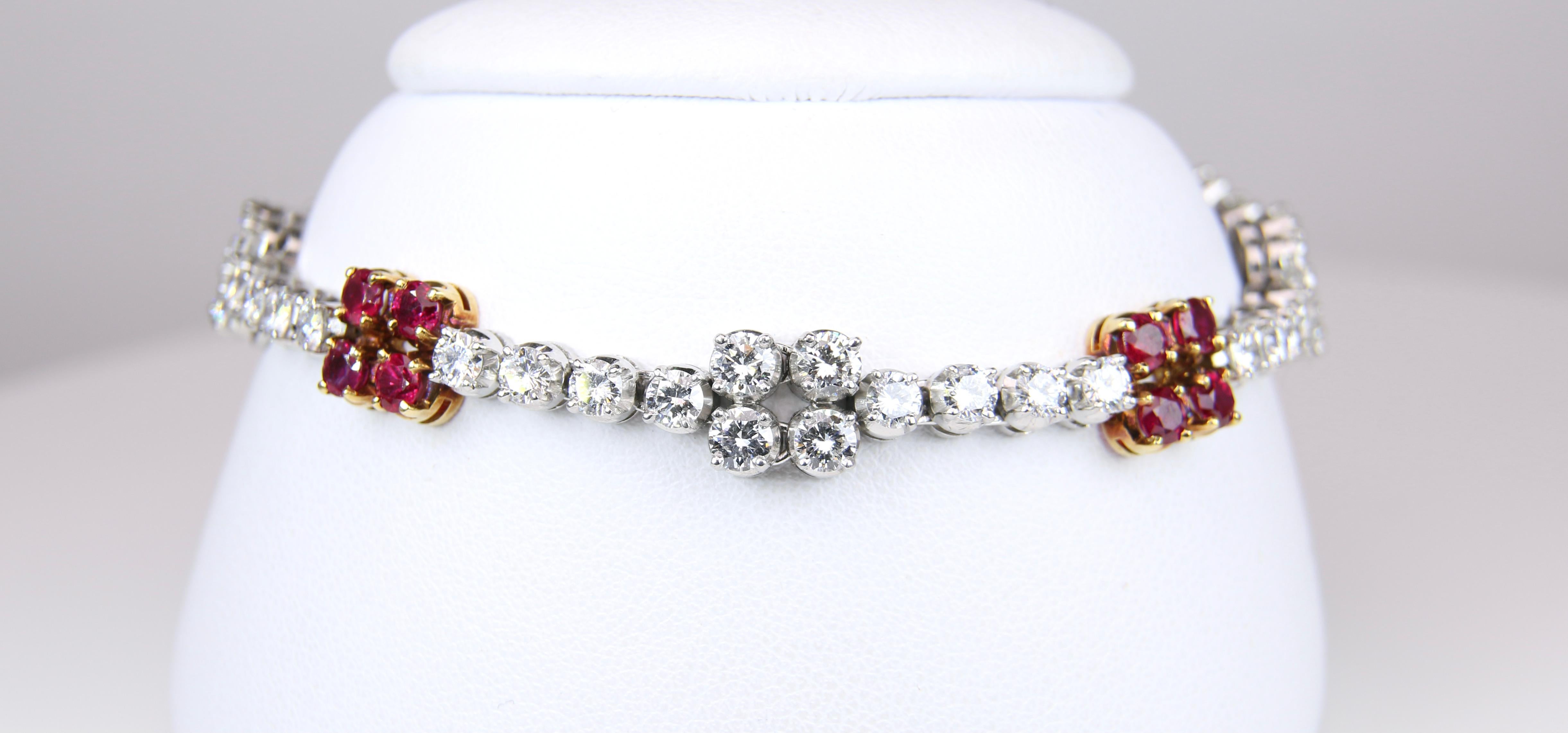 Platinum with 18K Yellow Gold Ruby and Diamond Bracelet.  This bracelet has four stations of four rubies interspersed with white diamonds set in platinum.  There are also four stations of four diamonds each.  It is a lovely piece which has 2.40