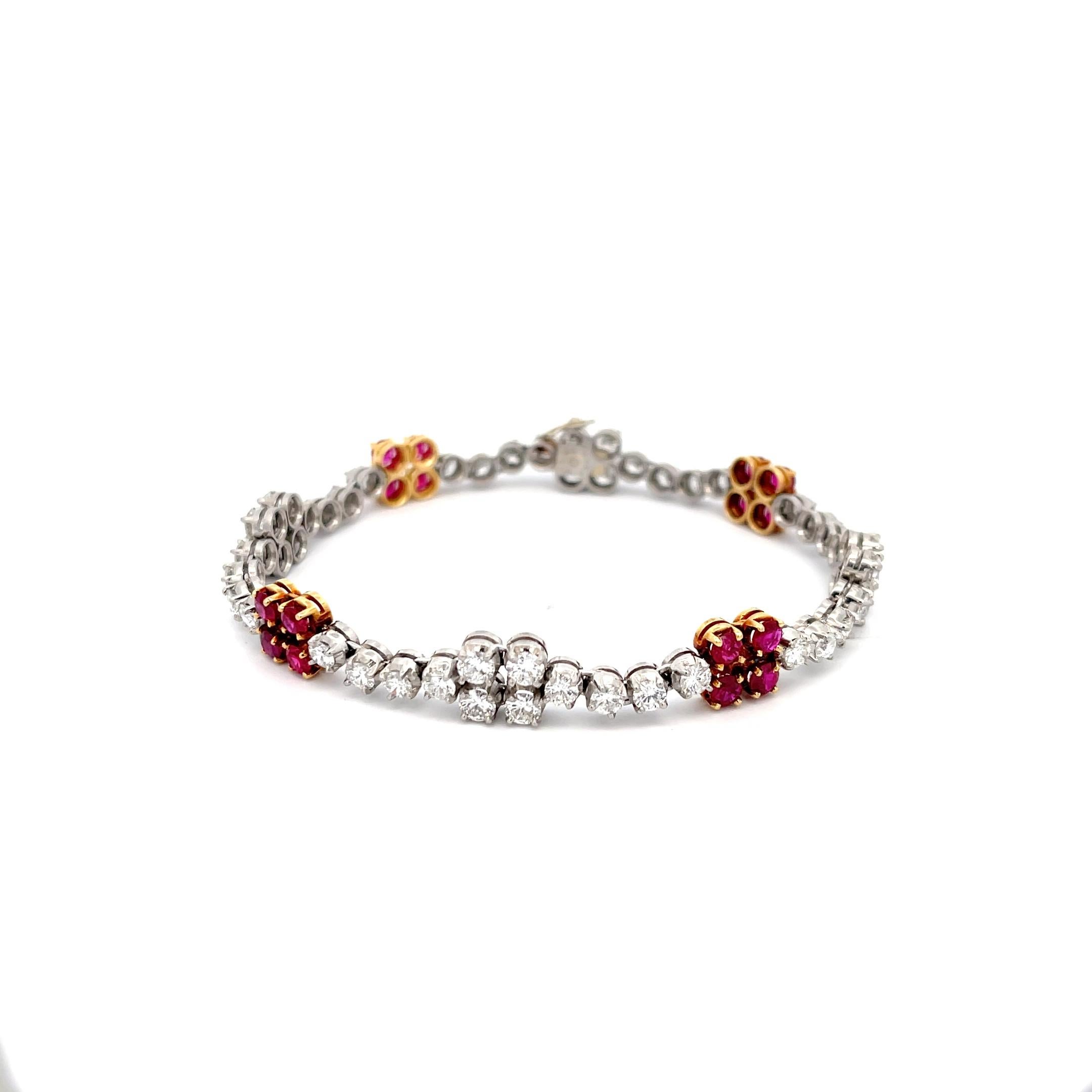 Ruby and Diamond Station Bracelet in Platinum and 18K Yellow Gold. The bracelet features approximately 2.40ctw of Rubies and 5.45ctw of Diamonds. 
7