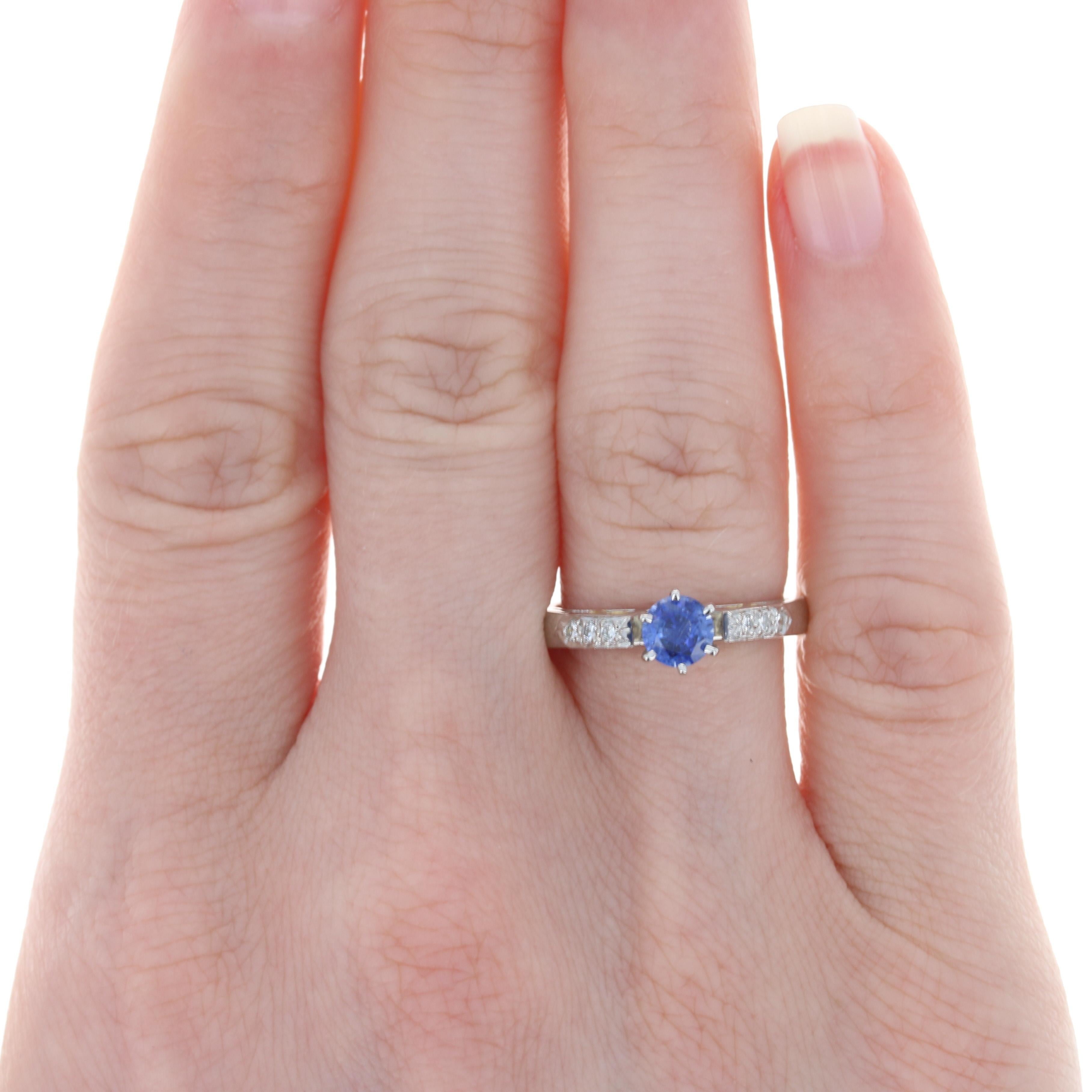 Size: 6
Sizing Fee: Up 2 sizes for $60 or Down 2 sizes for $50

Metal Content: Platinum & 18k Yellow Gold  

Stone Information: 
Genuine Sapphire
Treatment: Heating 
Carat: .58ct
Cut: Round 
Color: Blue 
Diameter: 5mm 

Natural Diamonds
Carats: