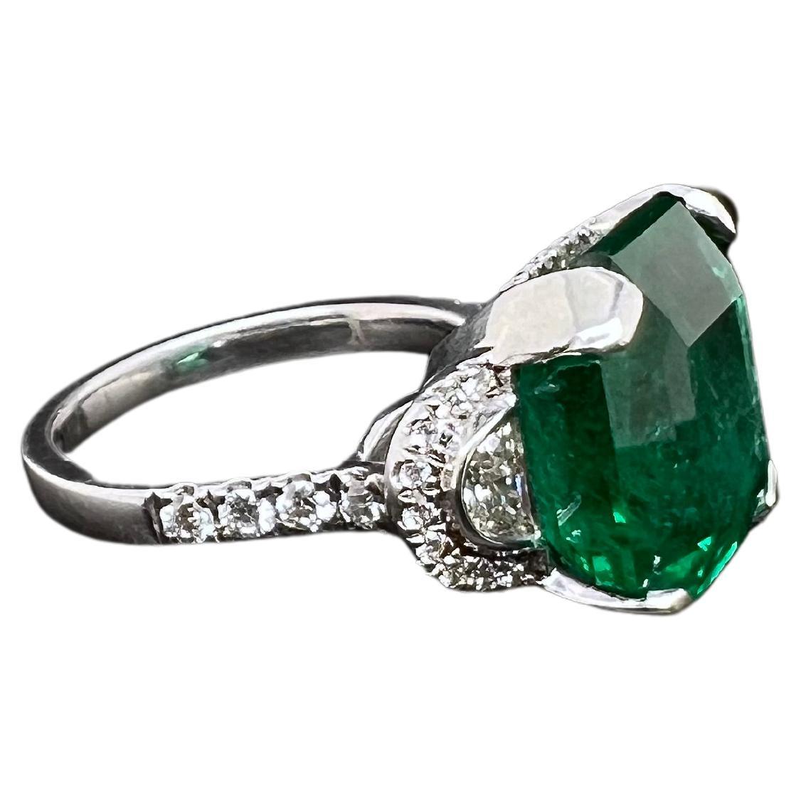 Emerald Cut Platinum Zambian Emerald Ring with Half Moon Diamonds For Sale