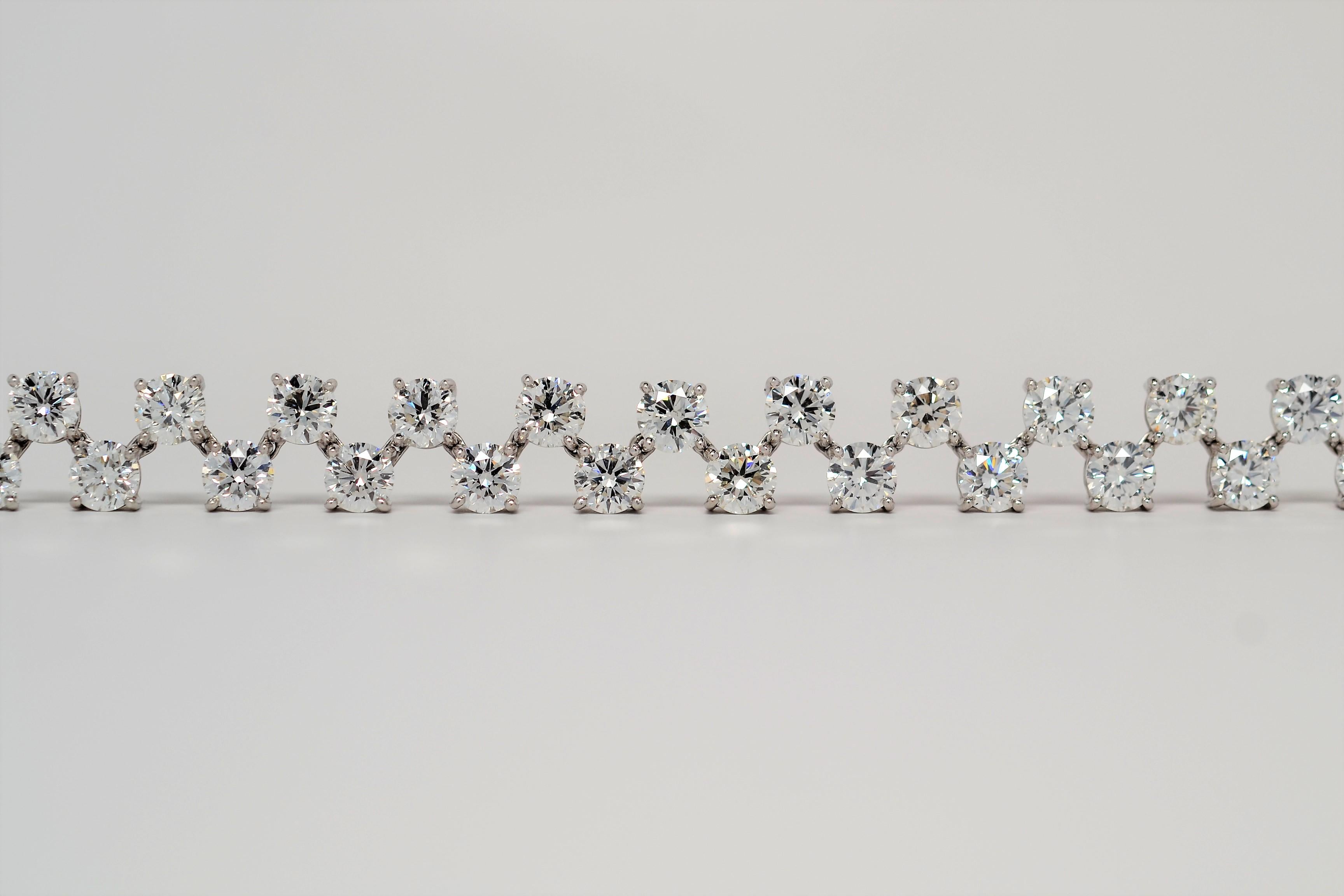 A fun and vibrant ladies' bracelet, set in Platinum with Round Brilliant Cut Diamonds. The bracelet is a Zig-Zag pattern of offset Round Brilliant Cut Diamonds with a two row layout. Each diamond is set in handmade Platinum basket with four prongs.