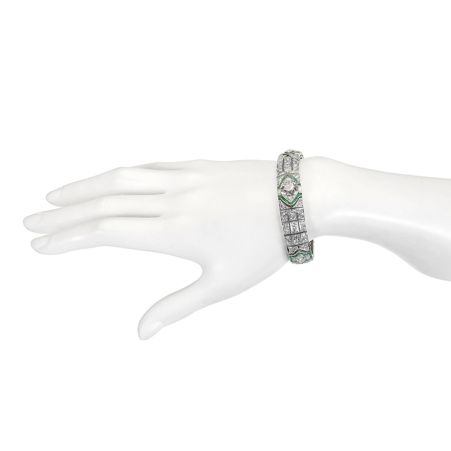 Timeless elegance in a beautifully hand-crafted Art Deco Platinum Diamond Bracelet. 
Center Diamond is an old European cut, weighing 3.12 carats (actual weight). J/K Color, VVS2 Clarity.
Two (2) marquise diamonds flank the center diamond and weigh