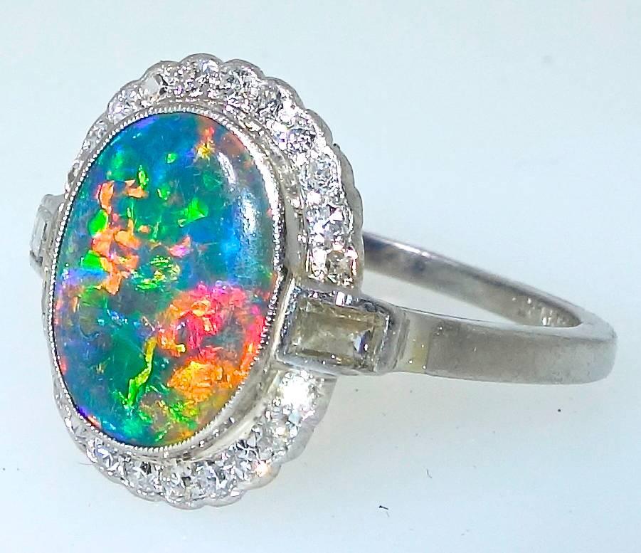 The finest black opals will display at least three vivid colors: greens, blues and most importantly red!   This stone has all three - with superb clear vivid colors.  From the Lightening Ridge area, Austrialia, this is a very fine example in