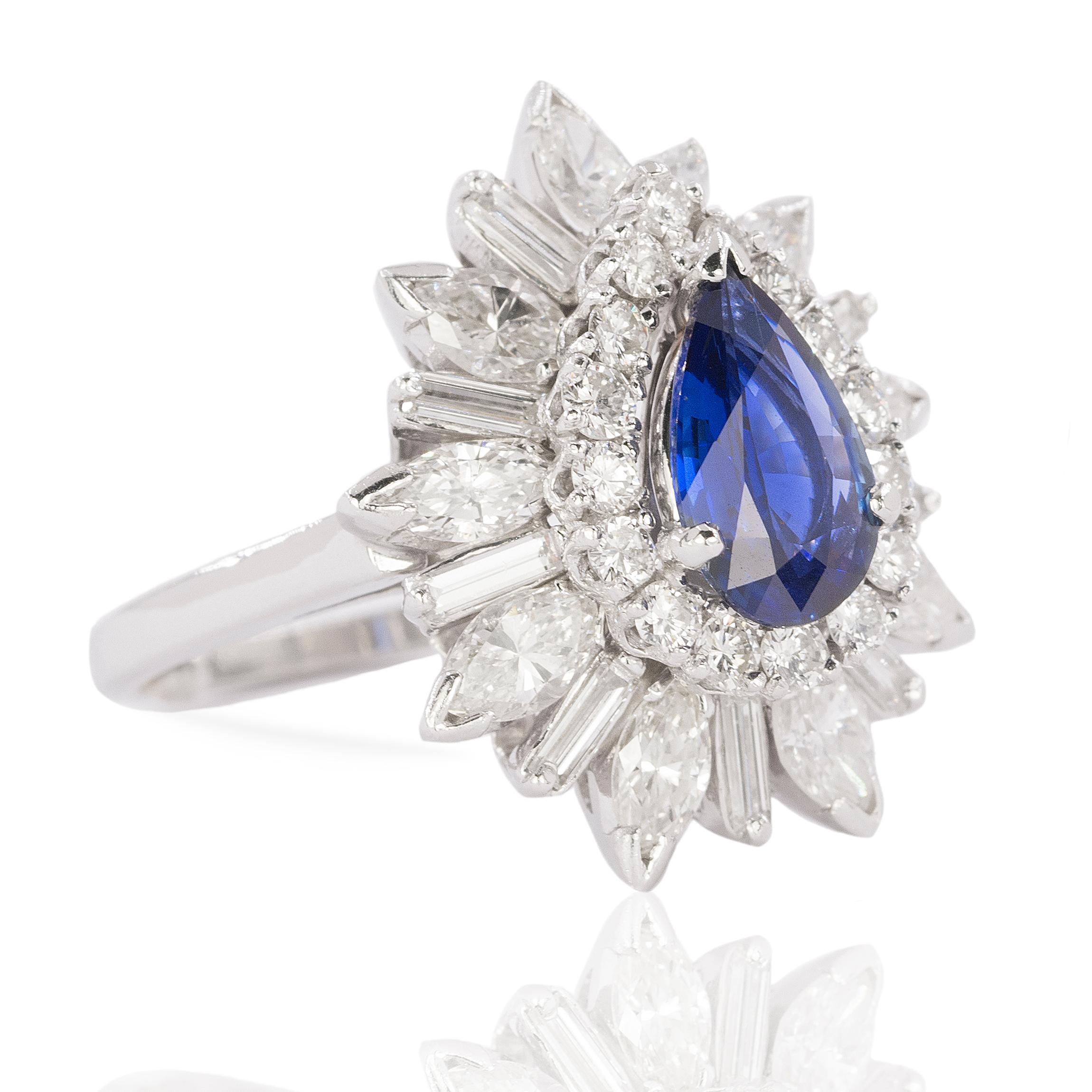 Platinum ring with 1.44 carat C. Dunaigre pear shape Burmese, no heat Sapphire and 17 round, 9 marquis and 9 aguette cut diamonds with an approximate total weight of 4.00 carats. 