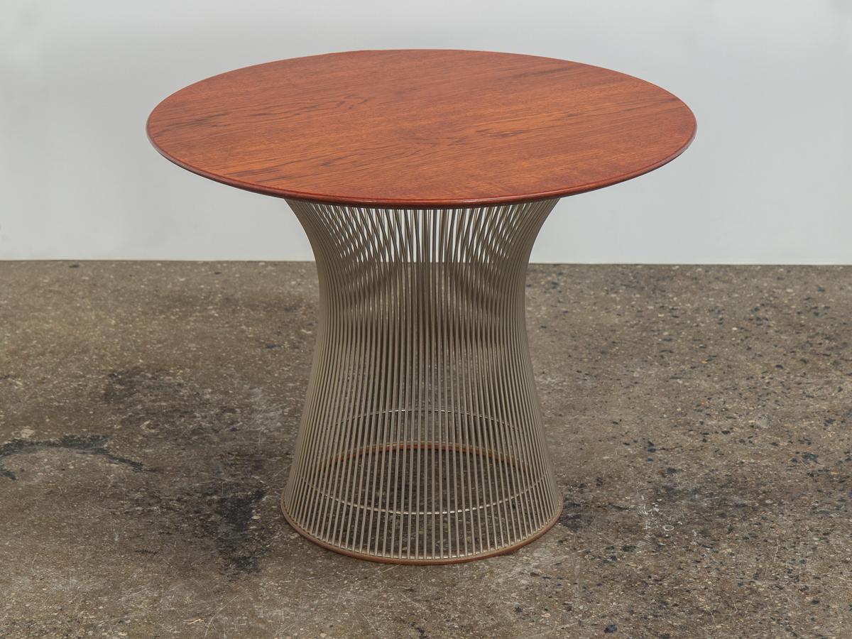 Original round walnut occasional table, designed by Warren Platner from his namesake collection for Knoll International. Steel wire base is shaped into a curved, organic form. Pristine circular walnut top adds warmth to the Industrial Design. Nice