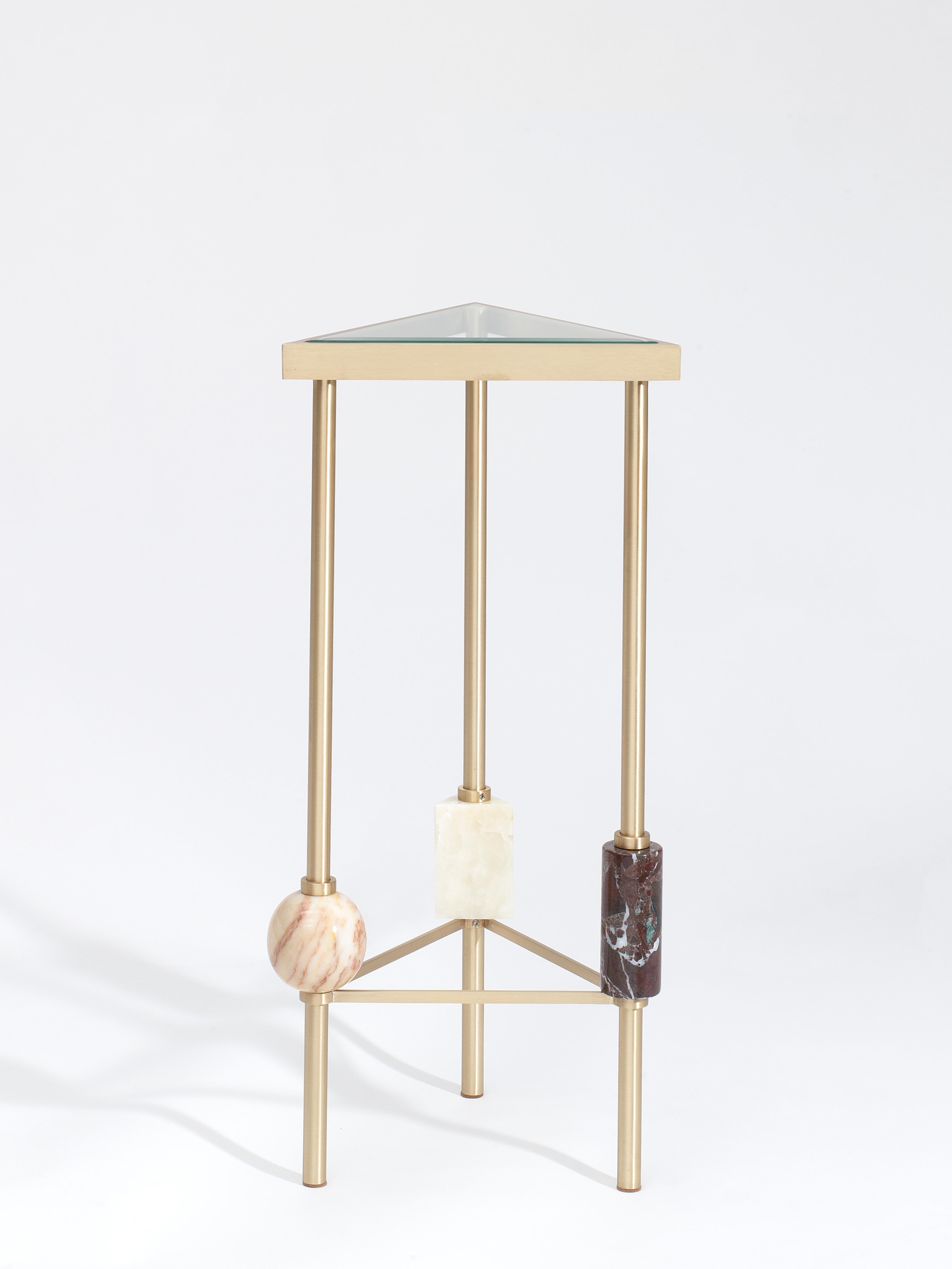 Plato cocktail table, multicolor, by Yasemin Toygar
Handmade
Dimensions: W 33 x D 33 x H 70 cm
Materials: Brass, marble, onyx, glass.

Plato Collection

Inspired by the geometric still life, Plato explores and defies the boundaries of sensory