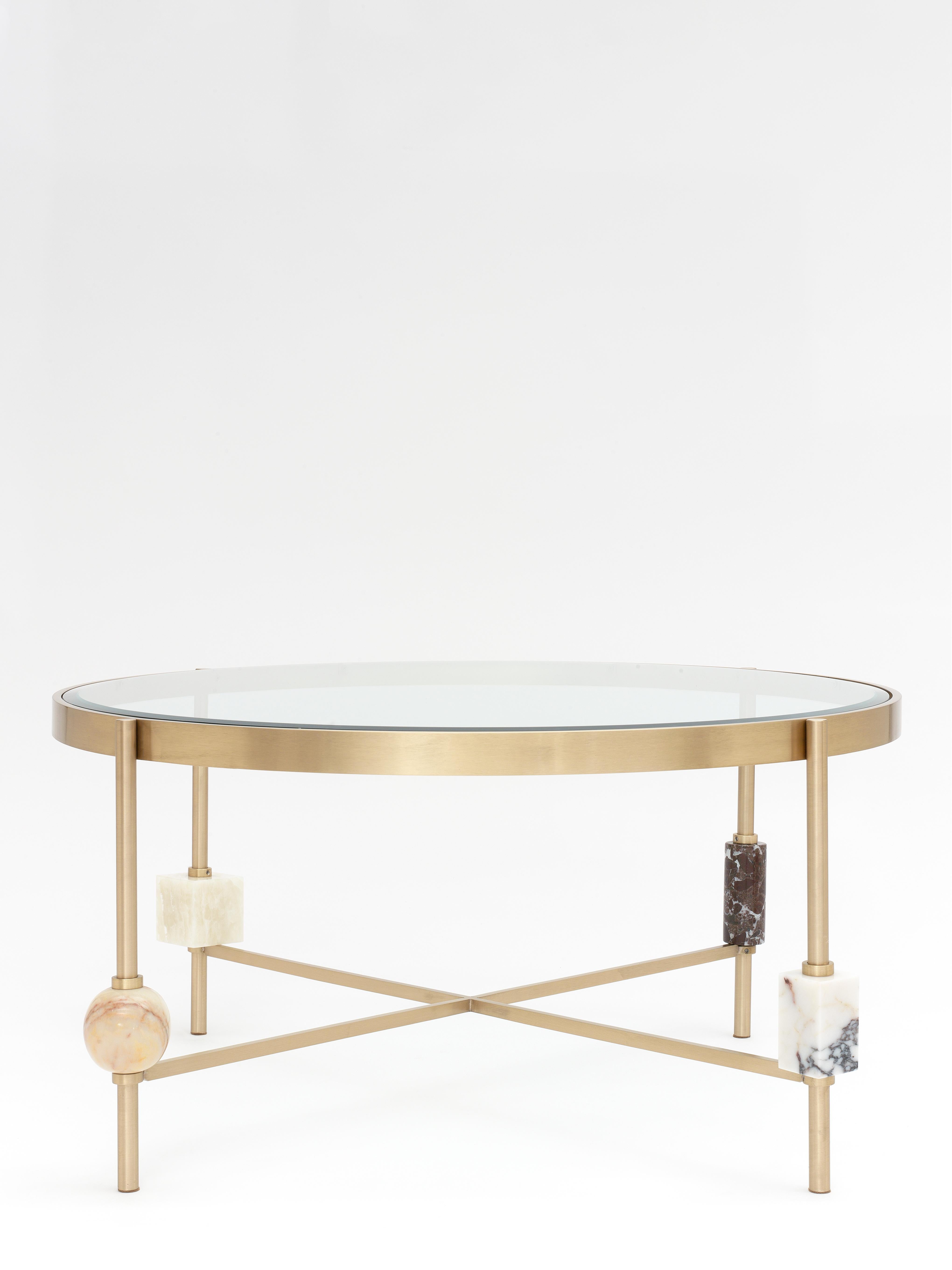 Plato coffee table by Yasemin Toygar
Handmade
Dimensions: W 90 x D 90 x H 45 cm
Materials: Brass, marble, onyx, glass.

Plato Collection

Inspired by the geometric still life, Plato explores and defies the boundaries of sensory experience of