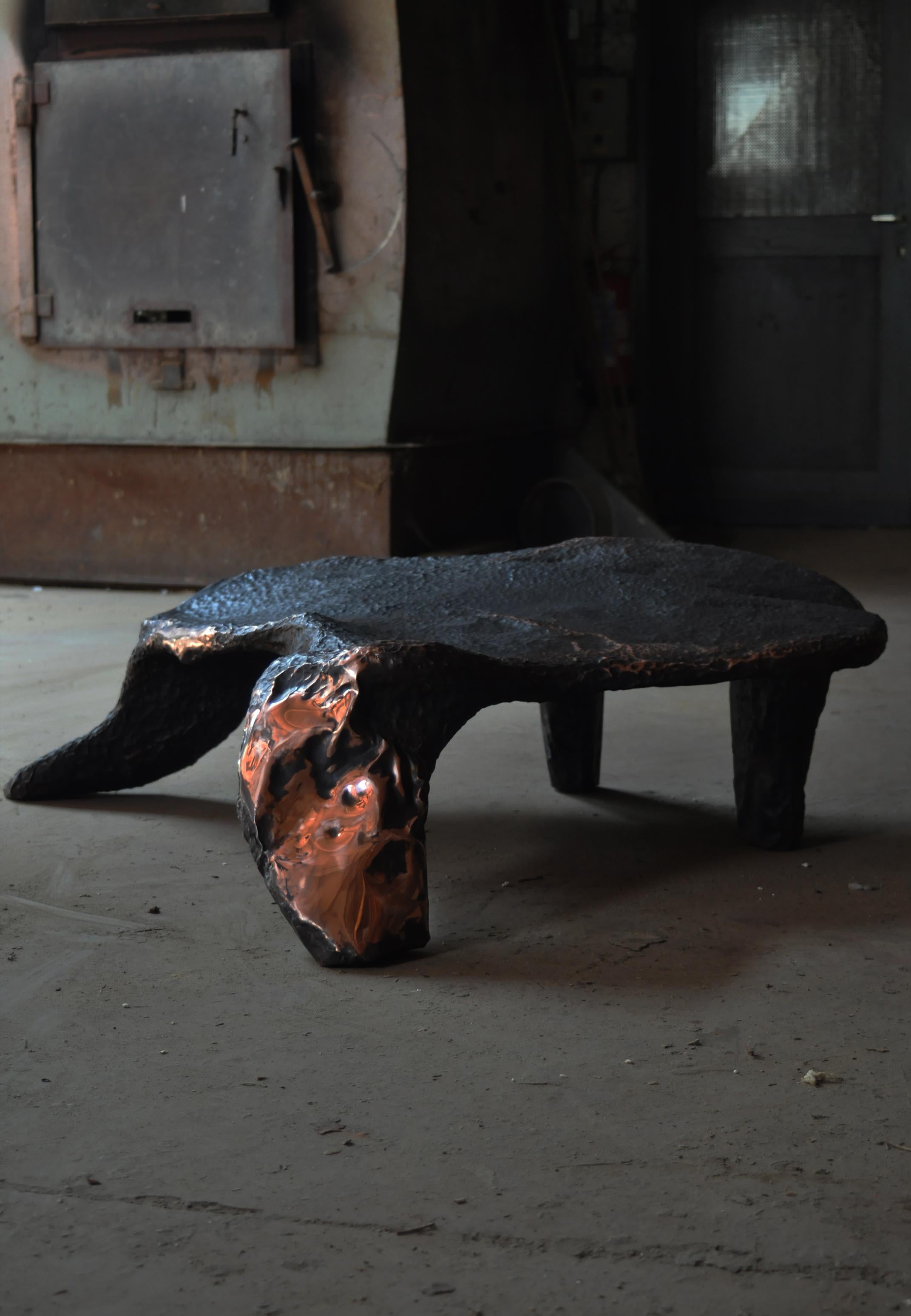 Platypus Low Table by by Marius Ritiu, Allienim
One Of A Kind.
Dimensions: D 180 x W 45 x H 90 cm.
Materials: Wood and copper.

Allienim
The overall effect of this piece is nothing short of magical, combining the ancient history of dragons and