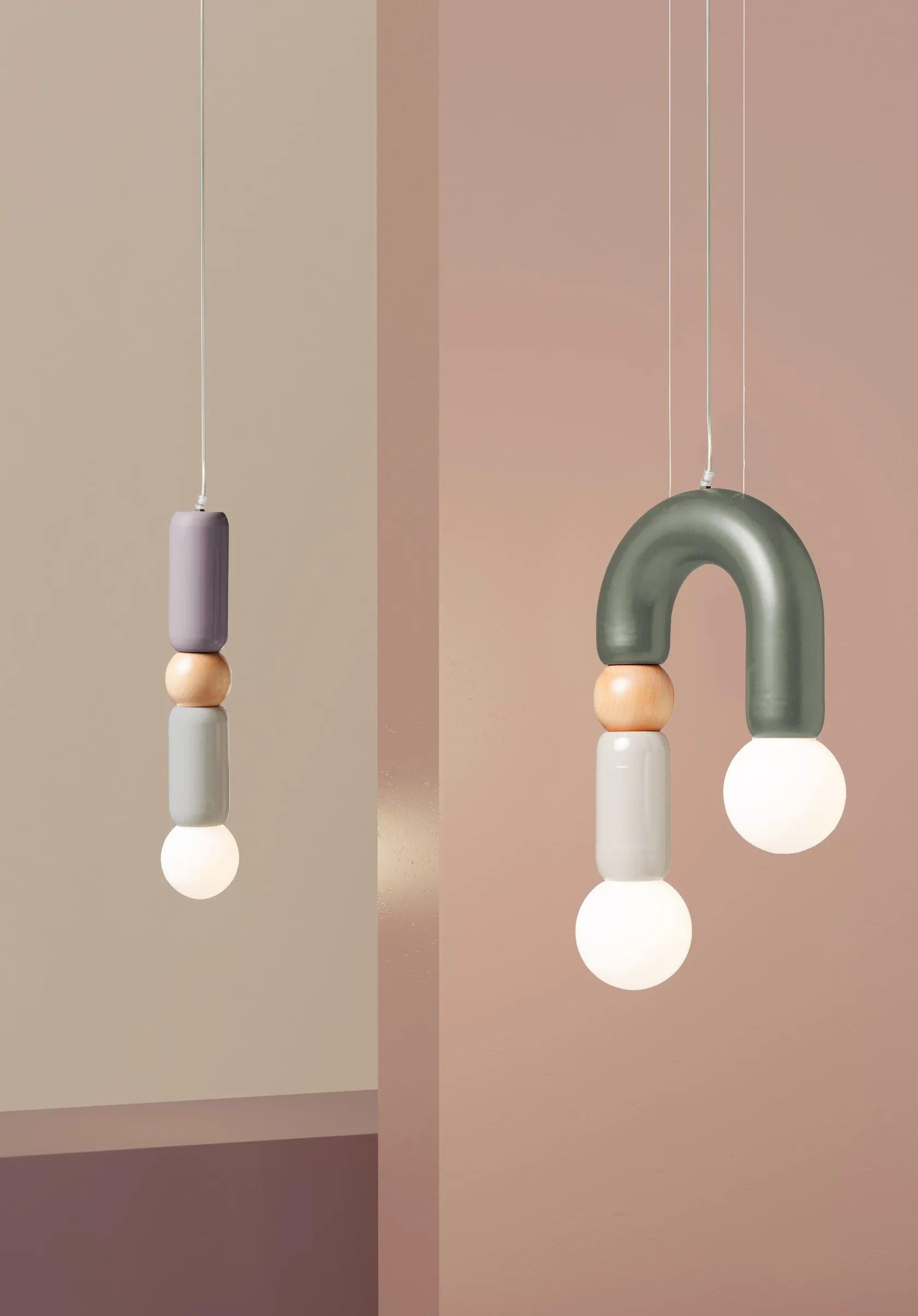Play I Pendant Lamp by Utu Lamps
Dimensions: D 14 x H 61 cm
Materials: Lacquered metal, Brass, Nickel/copper, Natural oak
Variations Available. Please contact us.

All our lamps can be wired according to each country. If sold to the USA it will be