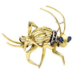 Playful 14 Karat Yellow Gold Cricket Brooch with Sapphire and Ruby Accents 