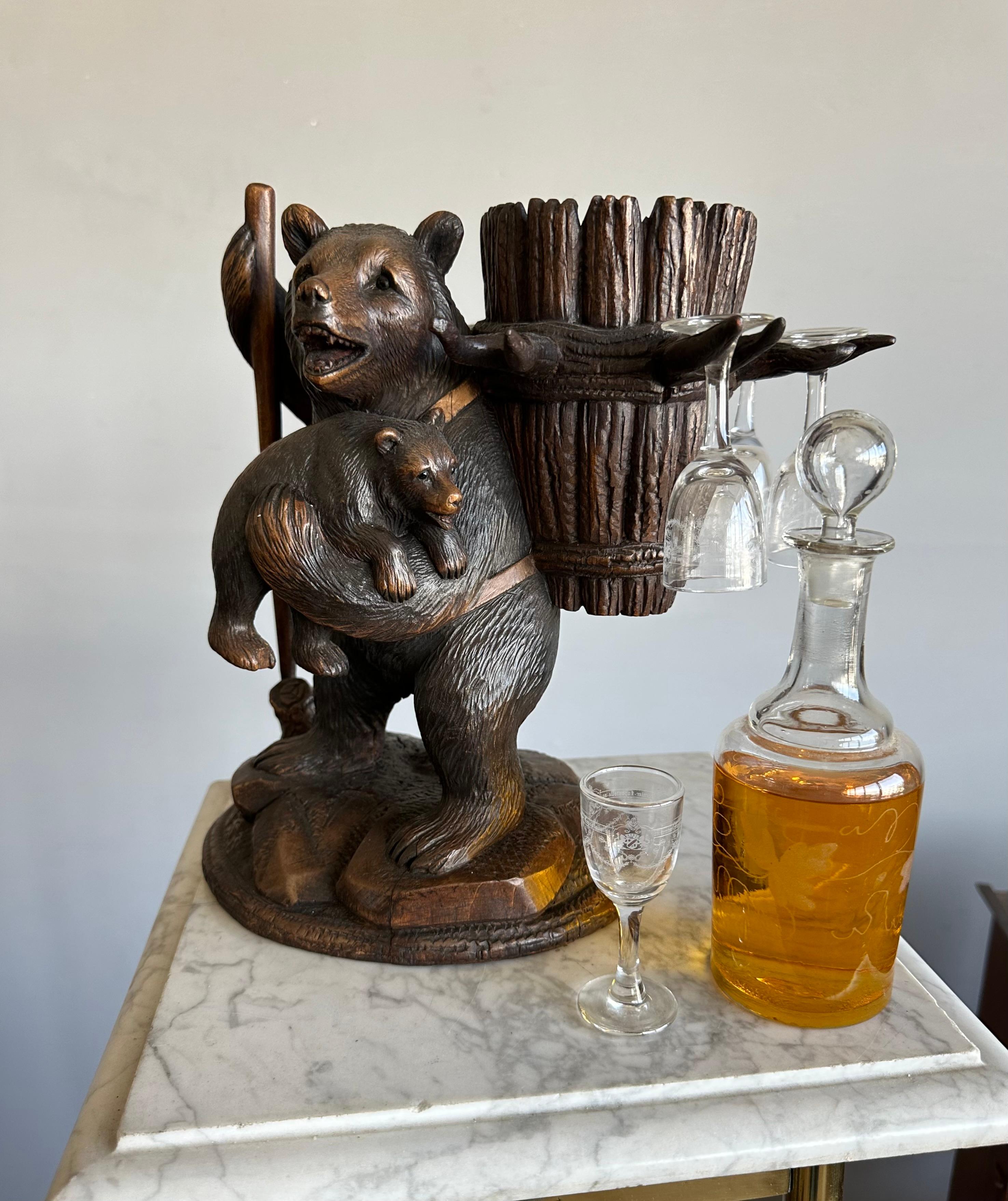 All hand-carved, Victorian Era, Black Forest hiking bear and cub, liquor tantalus set.

This finely carved Black Forest drinks set, dates from circa 1880 and it is both decorative and usefull. The beautifully etched glass brandy bottle rests inside