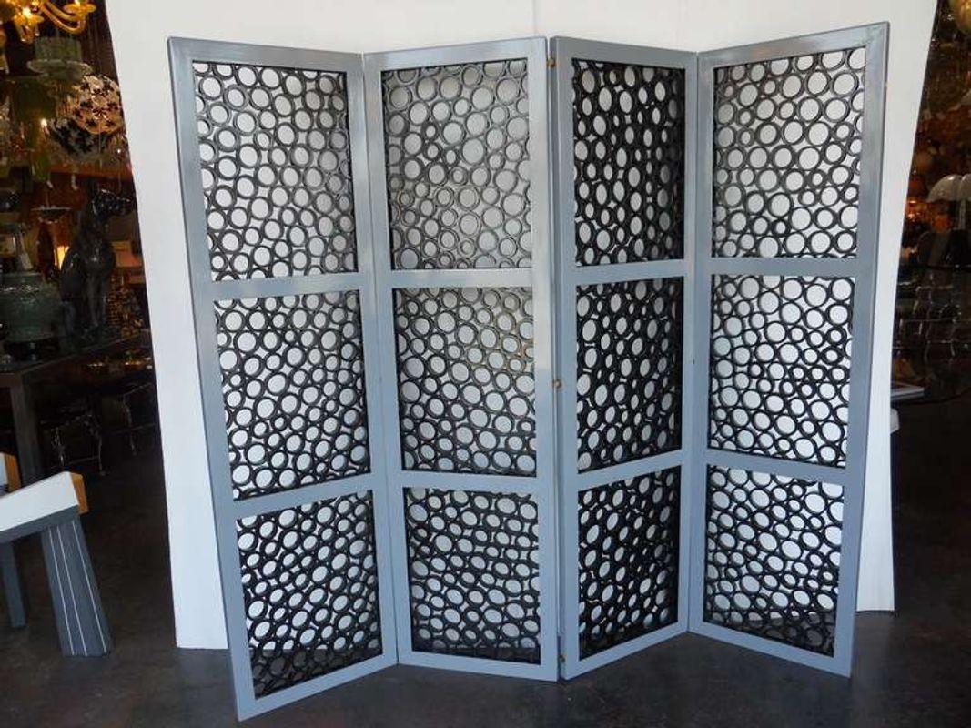 Playful crosscut bamboo screen by Oly Studio. Made with folding wood frame painted grey.
 
Dimensions:
 
70.75