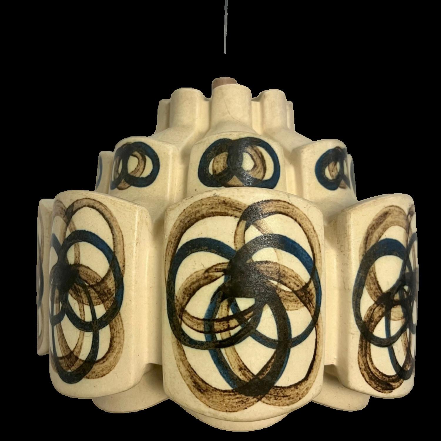 An exquisite hanging lamp with an unusual shape, made with rich colored ceramic with the shape of a flower in darker ceramic, manufactured in the 1970s in Denmark.

With beautiful fragile steel cable and wooden details. Hanging on a steel cable the