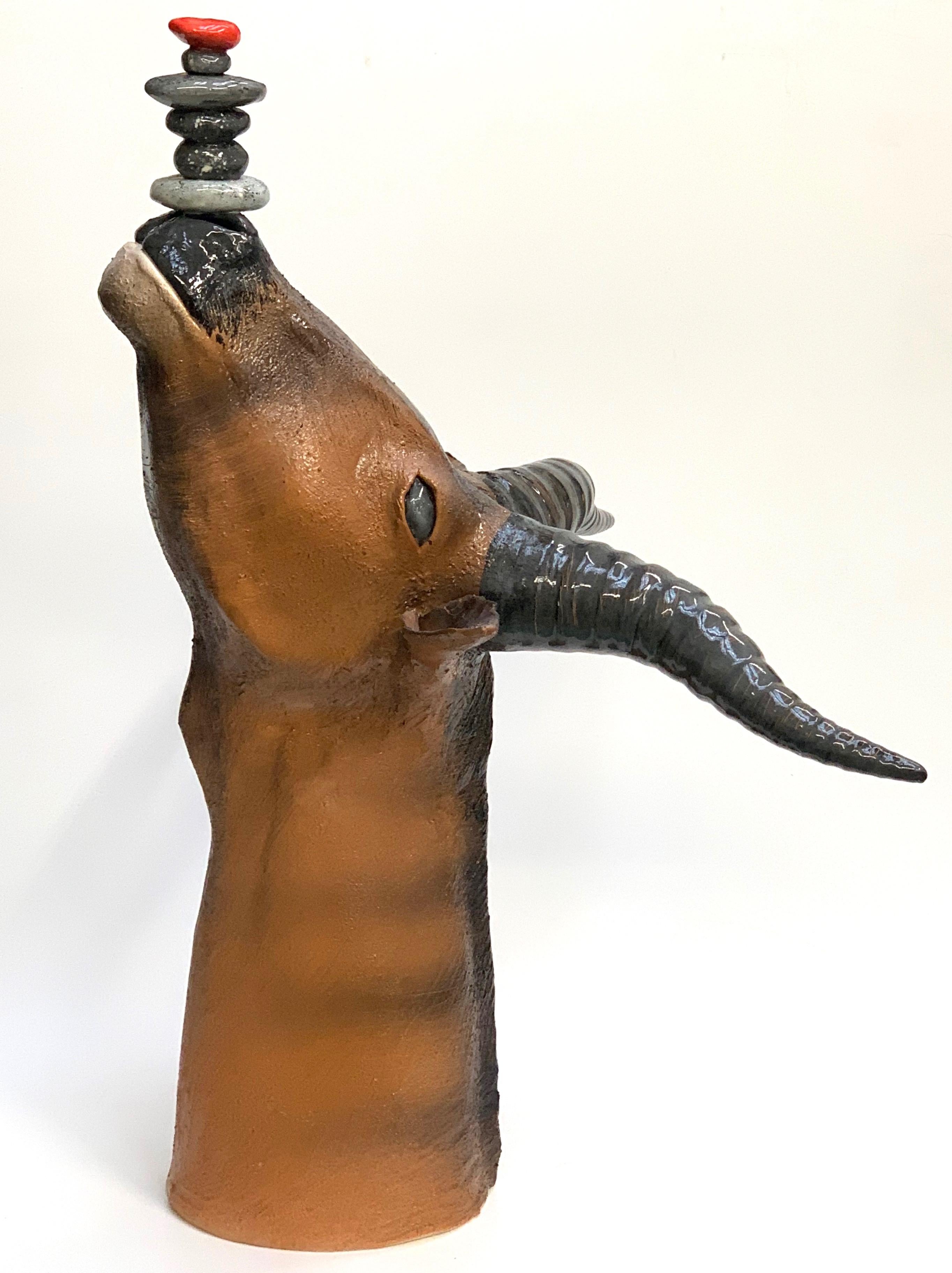 The piece is a unique representation of an Ibex in a modern way. The animal is playing with some little rocks on his nose.
Our designer creates these pieces completely by hand.
    