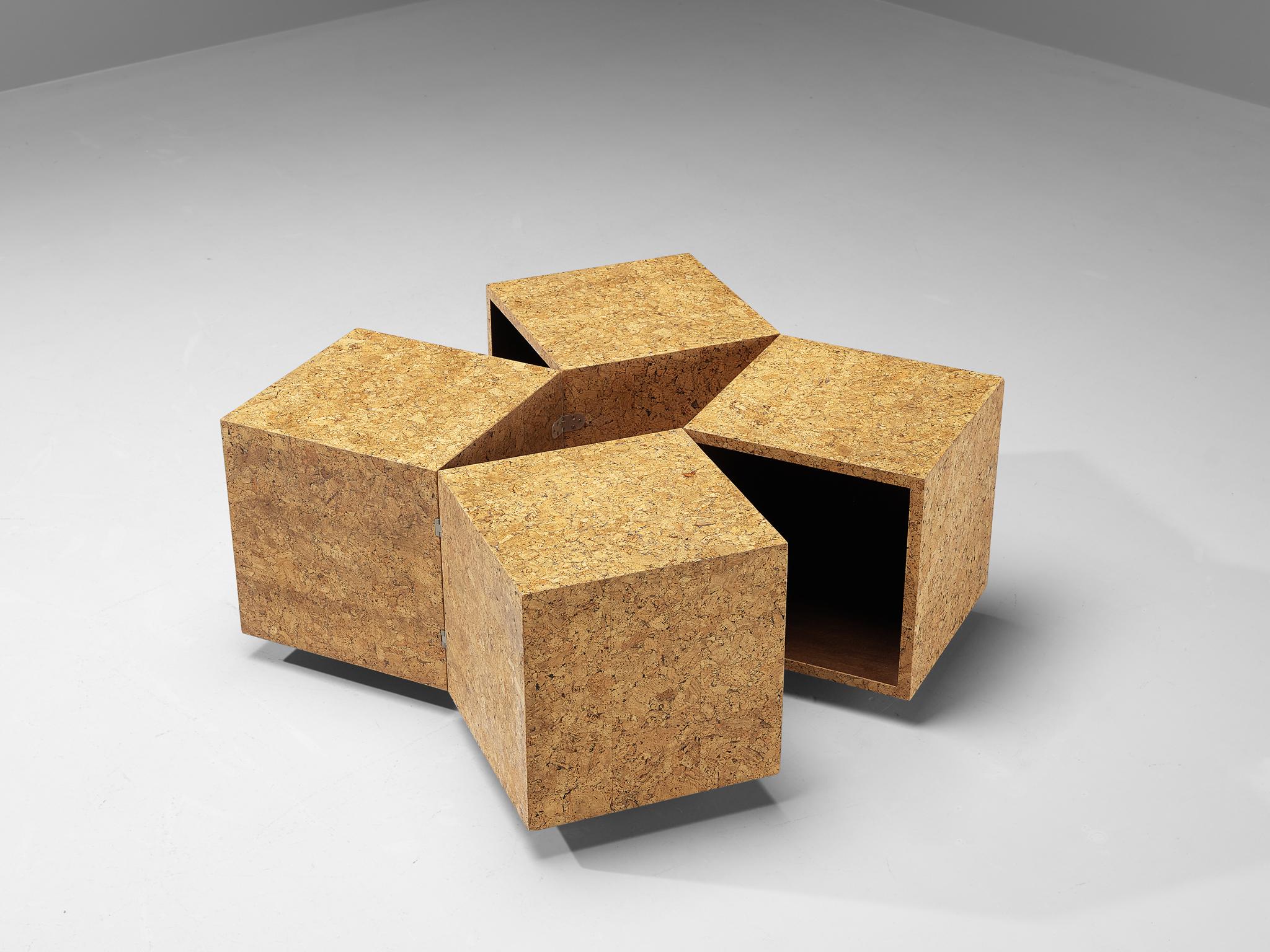 Transformable coffee or side table, cork, Europe, 1980s

This playful coffee or side table can easily be transformed into several functional shapes. It consists of four individual lacquered sections, linked to each other with metal connections. The