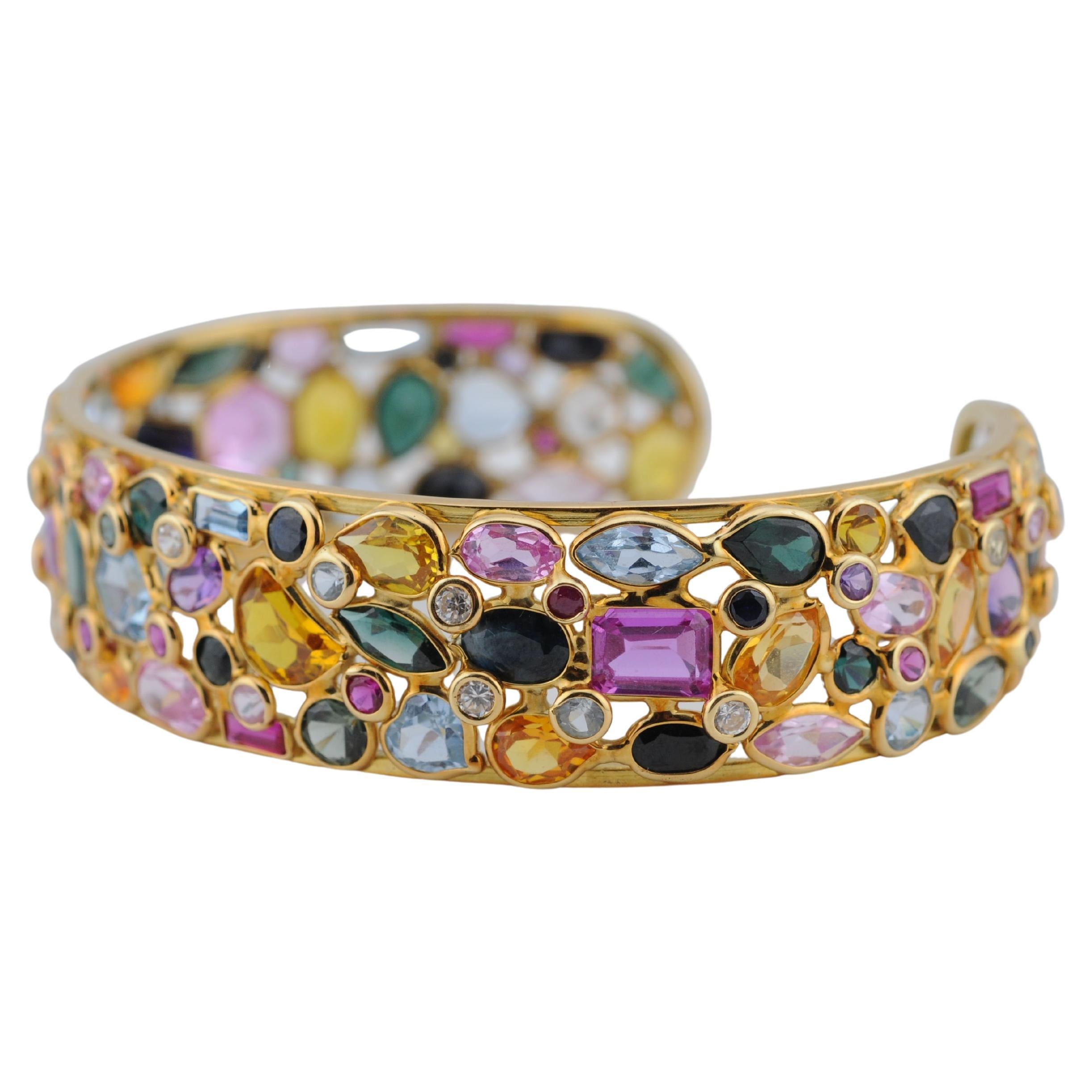 Bracciale Tutti Frutti in oro giallo 18K con pietre multiple

Bracciale in oro giallo 18 carati di ottima fattura, disegnato in un vivace stile 