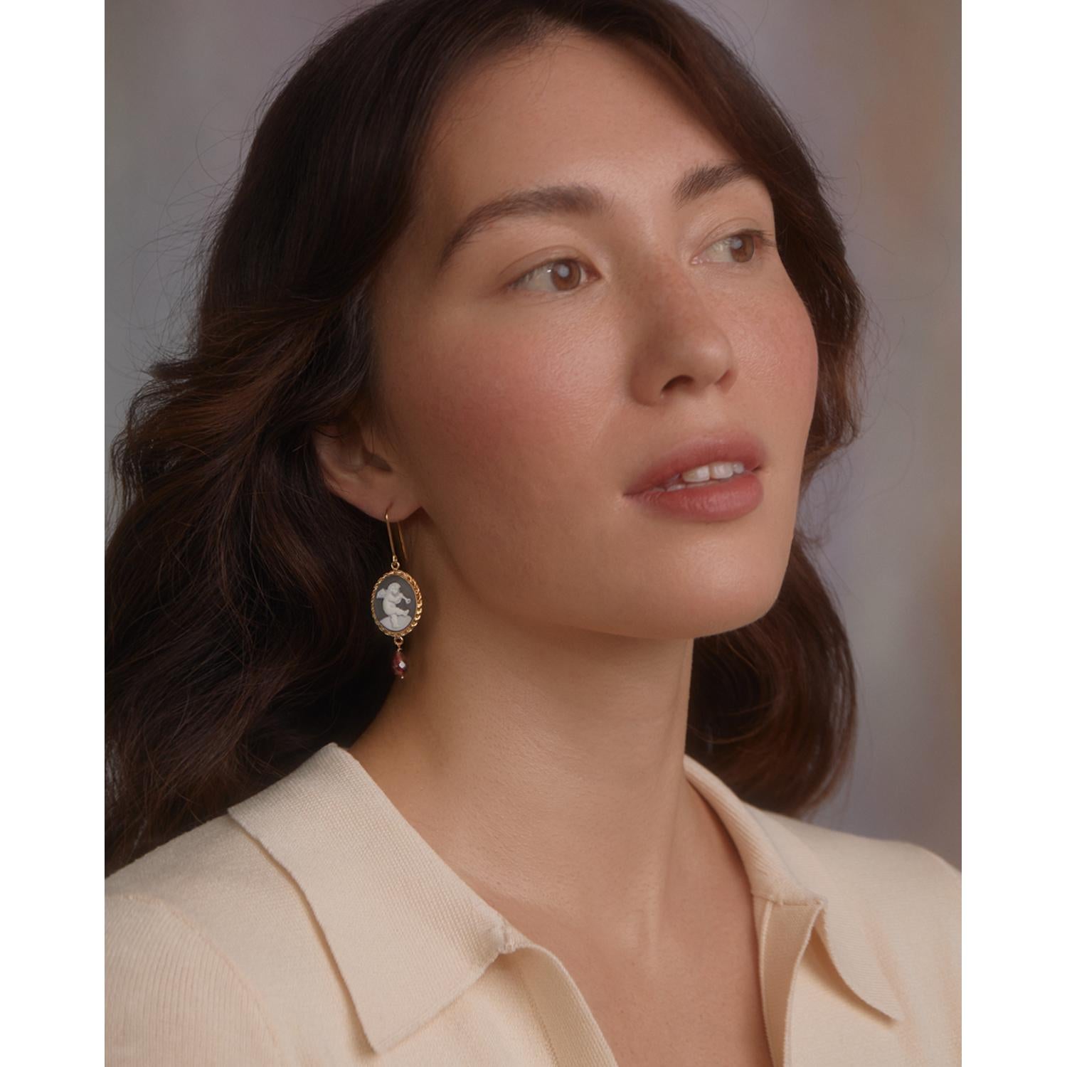 The Playing Angels cameo earrings by Vintouch Jewels are designed to celebrate the artistic heritage of Baroque that has shaped the landscapes of Southern Italy, the homeland of the brand. Handmade from 18-karat gold-plated silver, these earrings