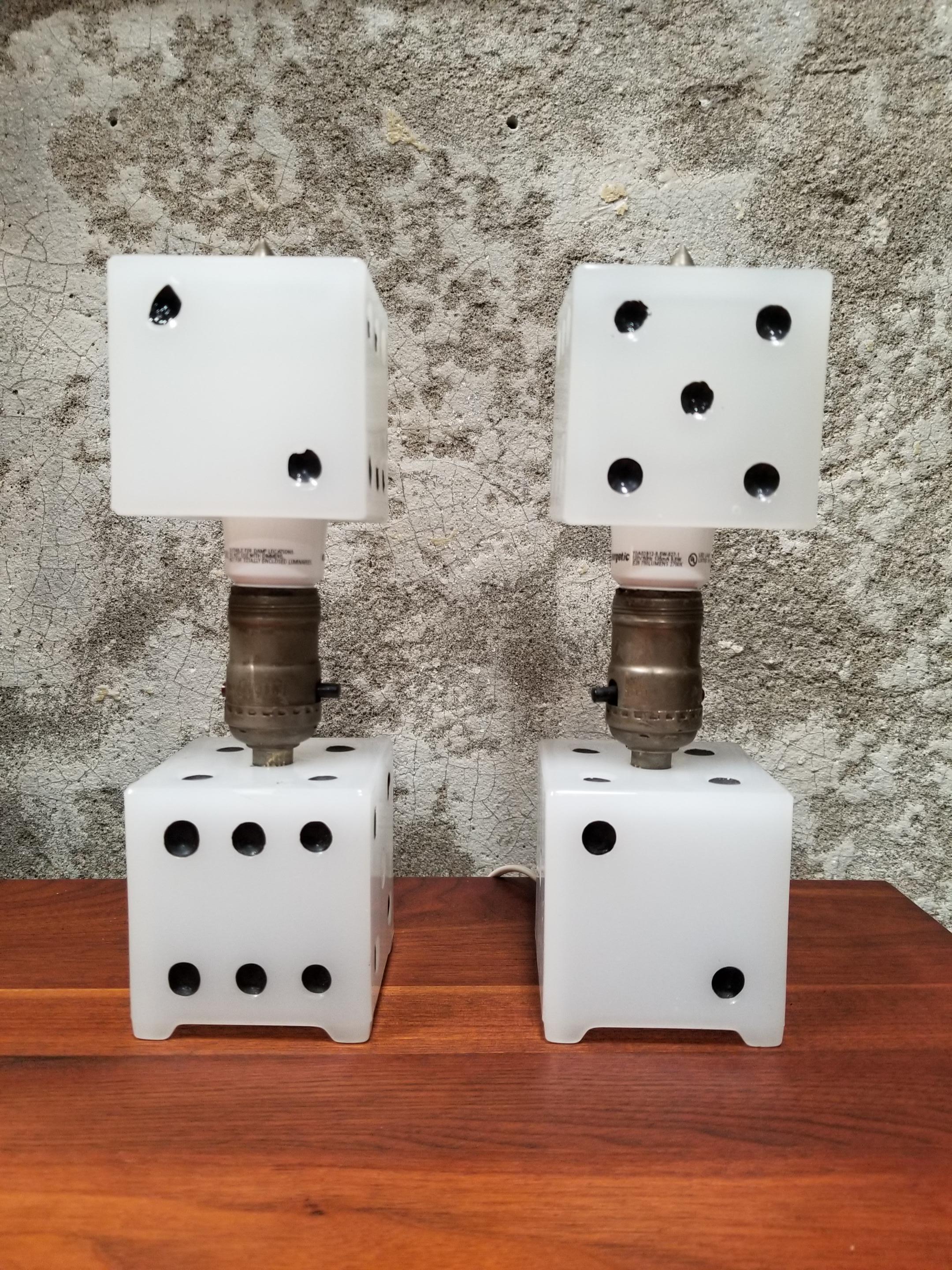 A whimsical pair table lamps made of milk glass with painted numbers. Original nickel-plated light sockets. Might be especially enjoyed by gamblers, board game players or as a fun, unusual source of light for a den or kids play room.