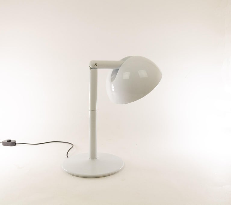 The Playmaker table lamp was designed by Adalberto Dal Lago and Rocco Sereni and manufactured by Bilumen in the 1970s.

Playmaker is an impressive table lamp due to its striking size and clear, robust design. The lampshade is fully adjustable.