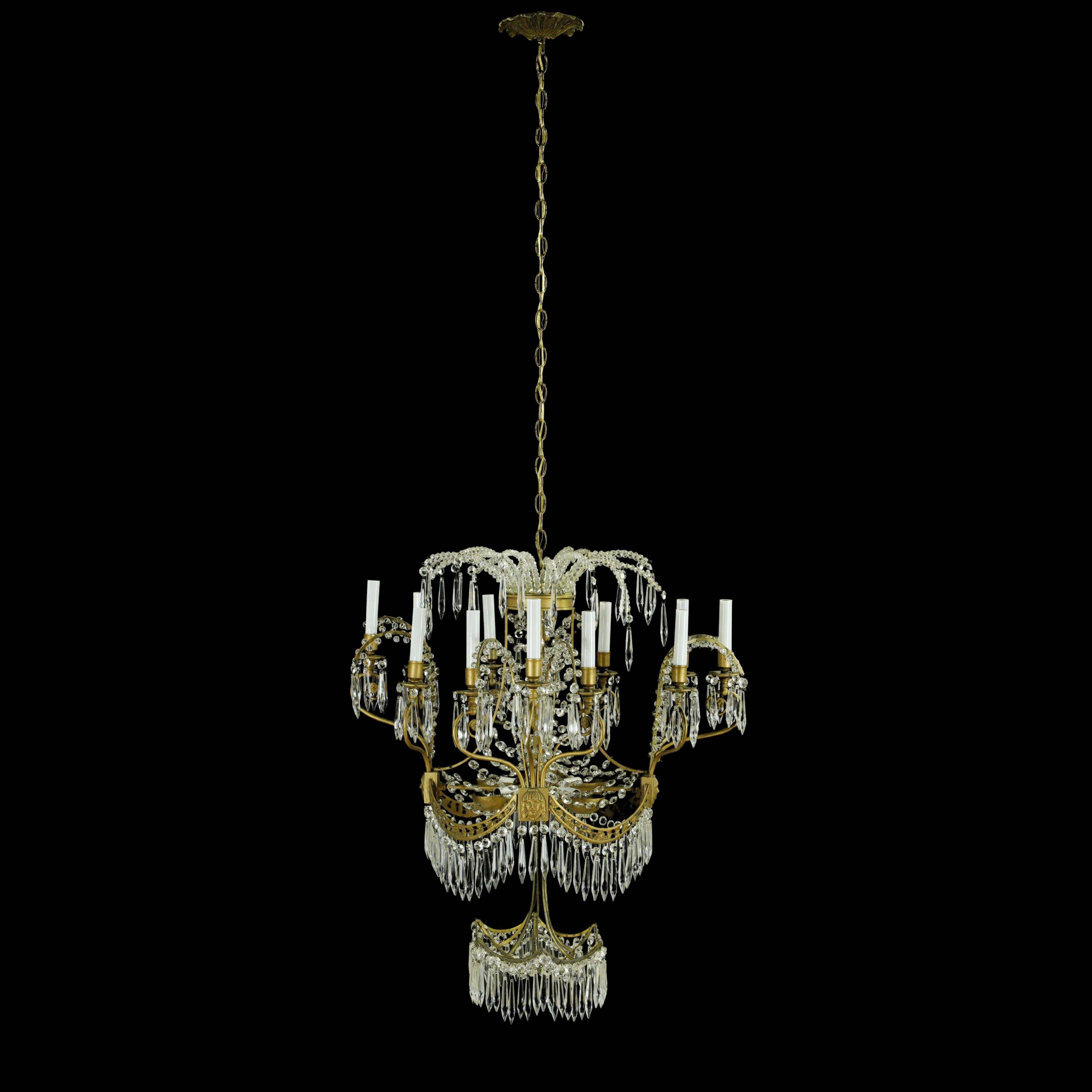 Russian crystal and Dore bronze 12 arm chandelier with figural details from the Plaza Hotel, New York, New York. It has been completely restored and rewired. This light requires 16 candelabra light bulbs. One available. Cleaned and restored. Please