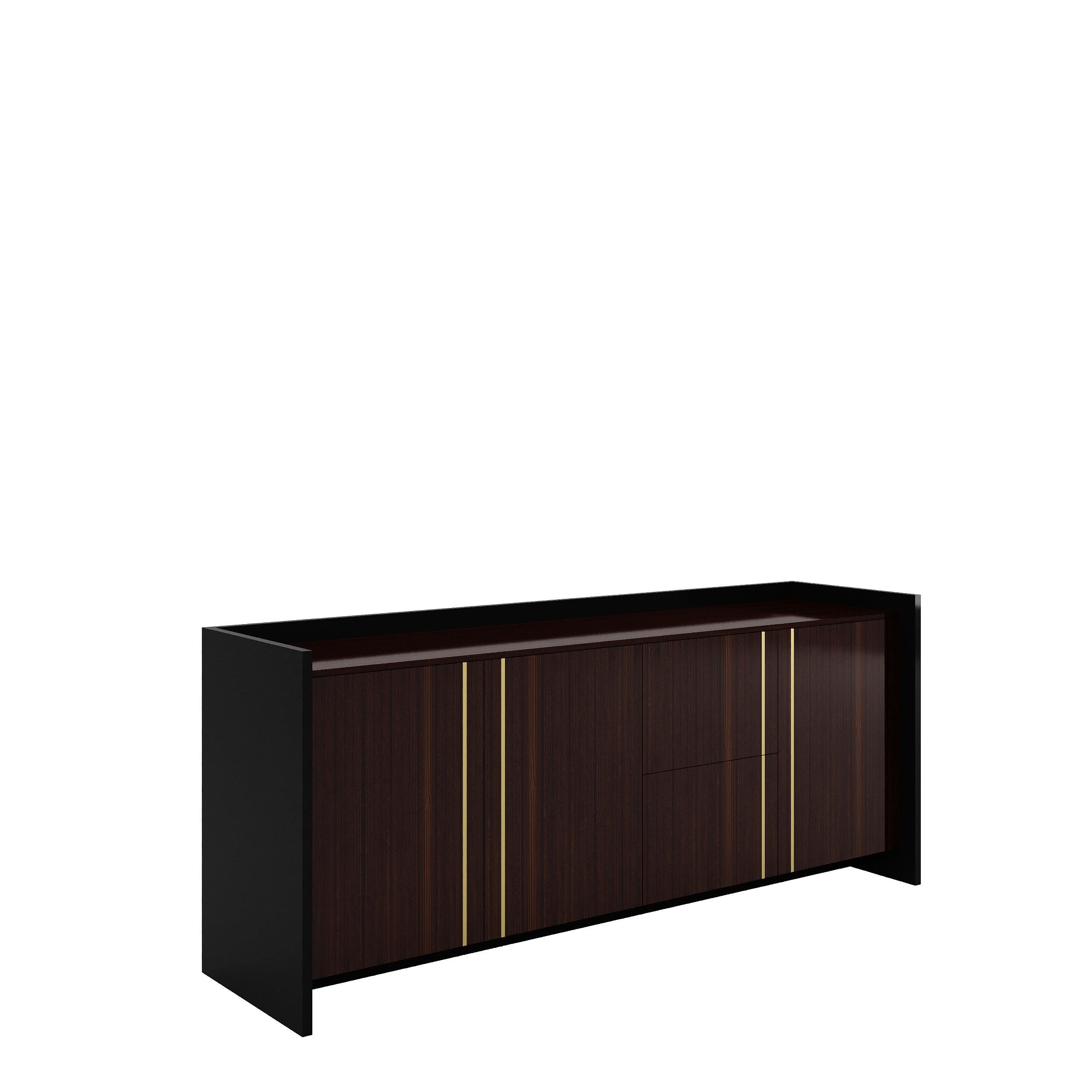 PLAZA is a beautiful wooden sideboard with inlaying doors and drawers, and stunning details lacquered in brass color.‎ Combining luxury design with brilliant craftsmanship, this is a timeless furniture creation.‎ Plaza includes cutlery drawer, lined