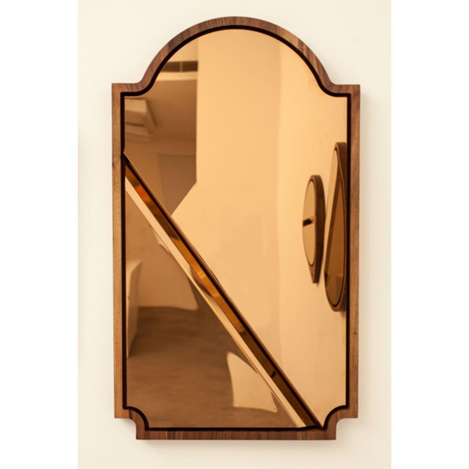 Please don't tell mom mirror 3 by Marc Dibeh
2015
Materials: American walnut, polished stainless steel, rose gold finish
Dimensions: W 56 x H 93 x D 4 cm 

This happy accident, caused by coincidently breaking a mirror during an experiment, lead