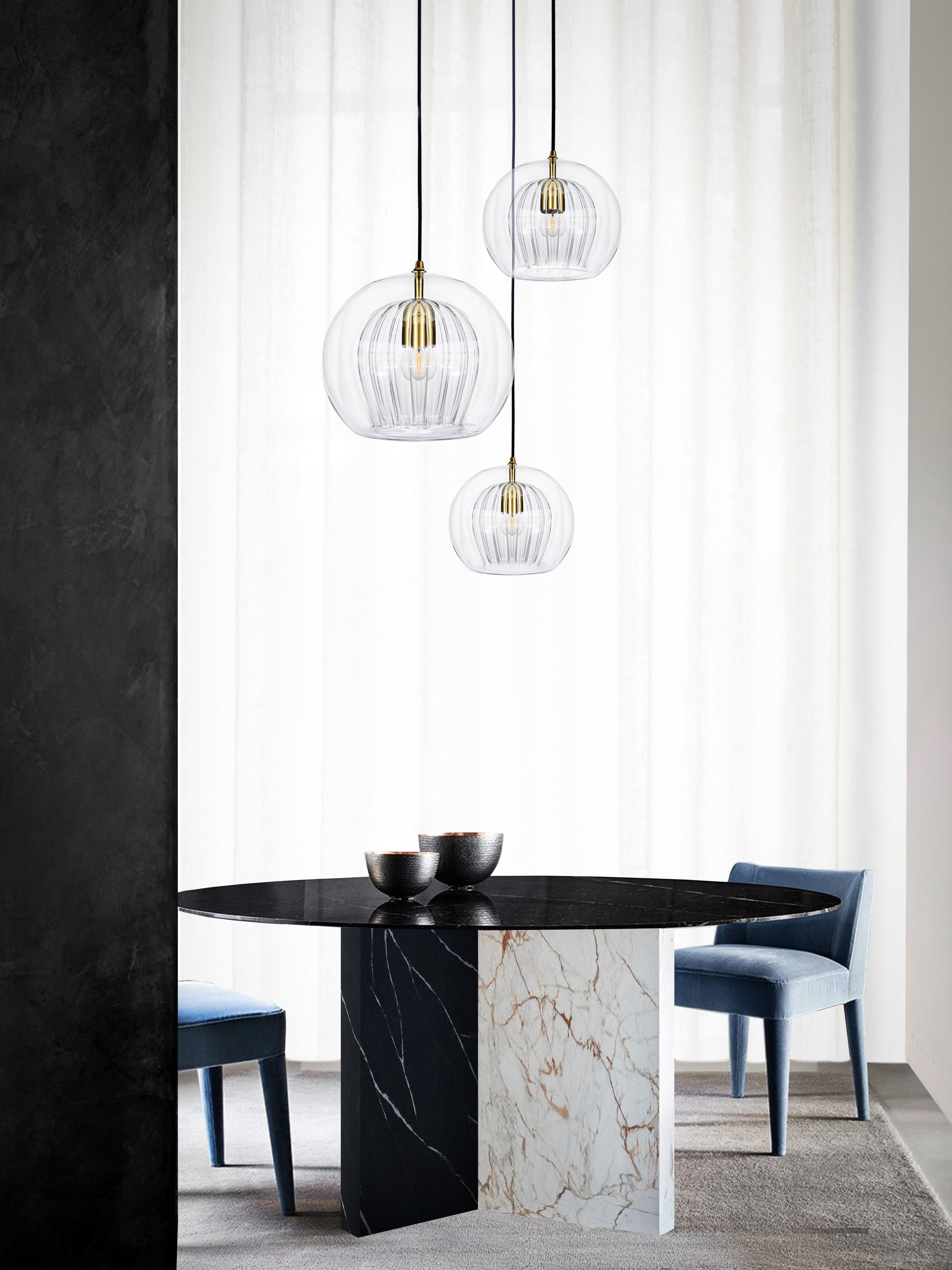 Our debut lighting collection comprising ceiling pendants, a side light and a floor standing lamp.

Handmade in Bohemia and London the collection draws upon our love for Czech artisan glass work and British engineered detailing.

Designed with