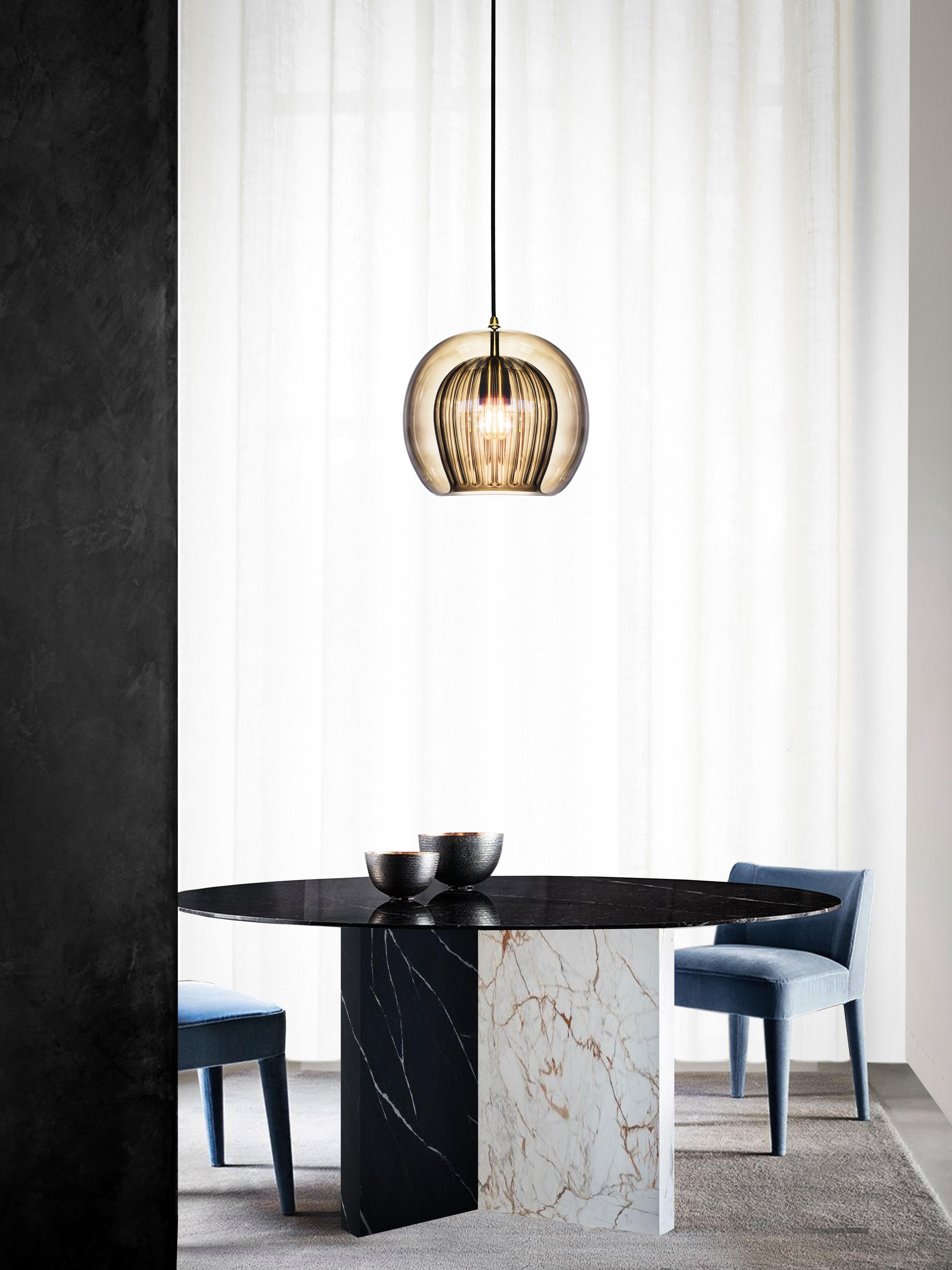 Our debut lighting collection comprising ceiling pendants, a side light and a floor standing lamp.

Handmade in Bohemia and London the collection draws upon our love for Czech artisan glass work and British engineered detailing.

Designed with