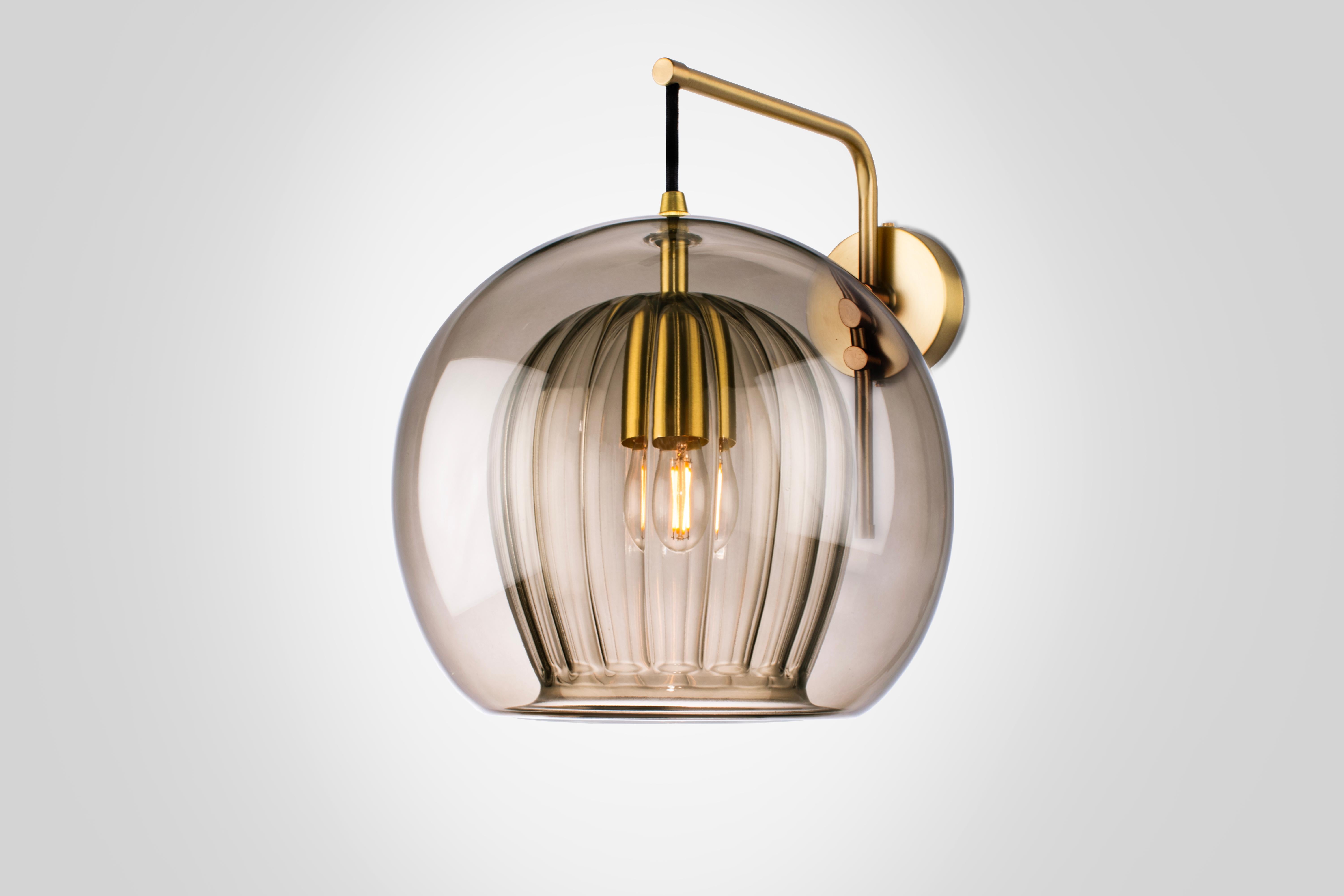 Our debut lighting collection comprising ceiling pendants, a side light and a floor standing lamp.

Handmade in Bohemia and London the collection draws upon our love for Czech artisan glass work and British engineered detailing.

Designed with