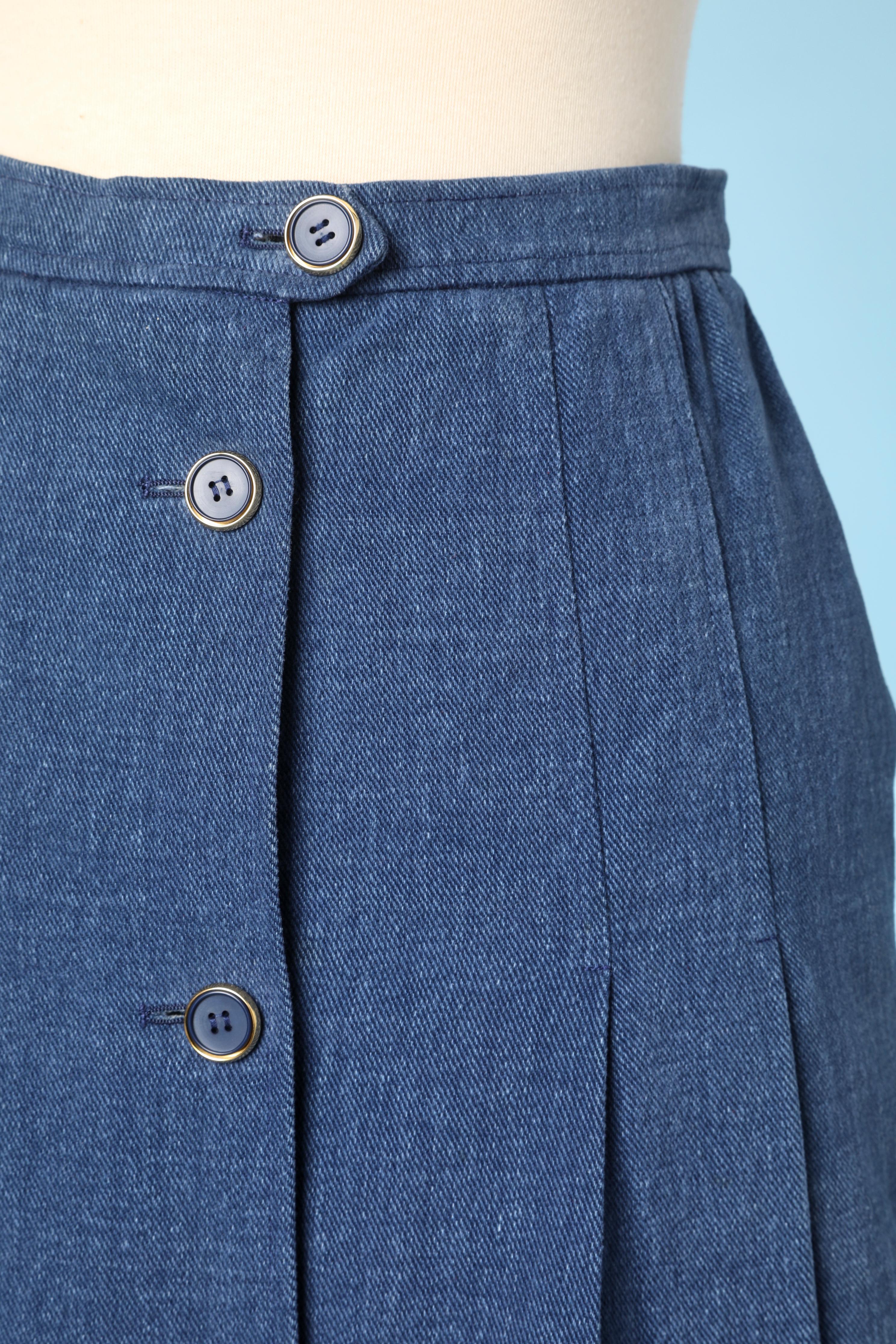 Pleated denim cotton skirt with buttons in the middle front. No lining. 
SIZE 38