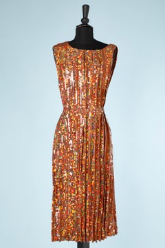 Abito plissettato con paillettes arancioni su una base di crêpe di seta  Nina Ricci