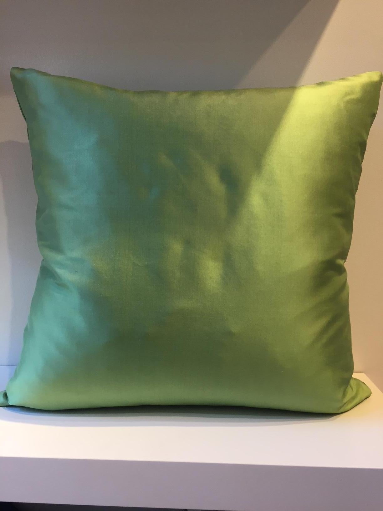 Decorative cushion: taffeta silk fabric, color green with embossed front panel in steam pleated basket weave pattern, back panel plain silk taffeta, 50 x 50cm, concealed zipper in the bottom seam, cotton lining, feather inner pad,
1 no cushion