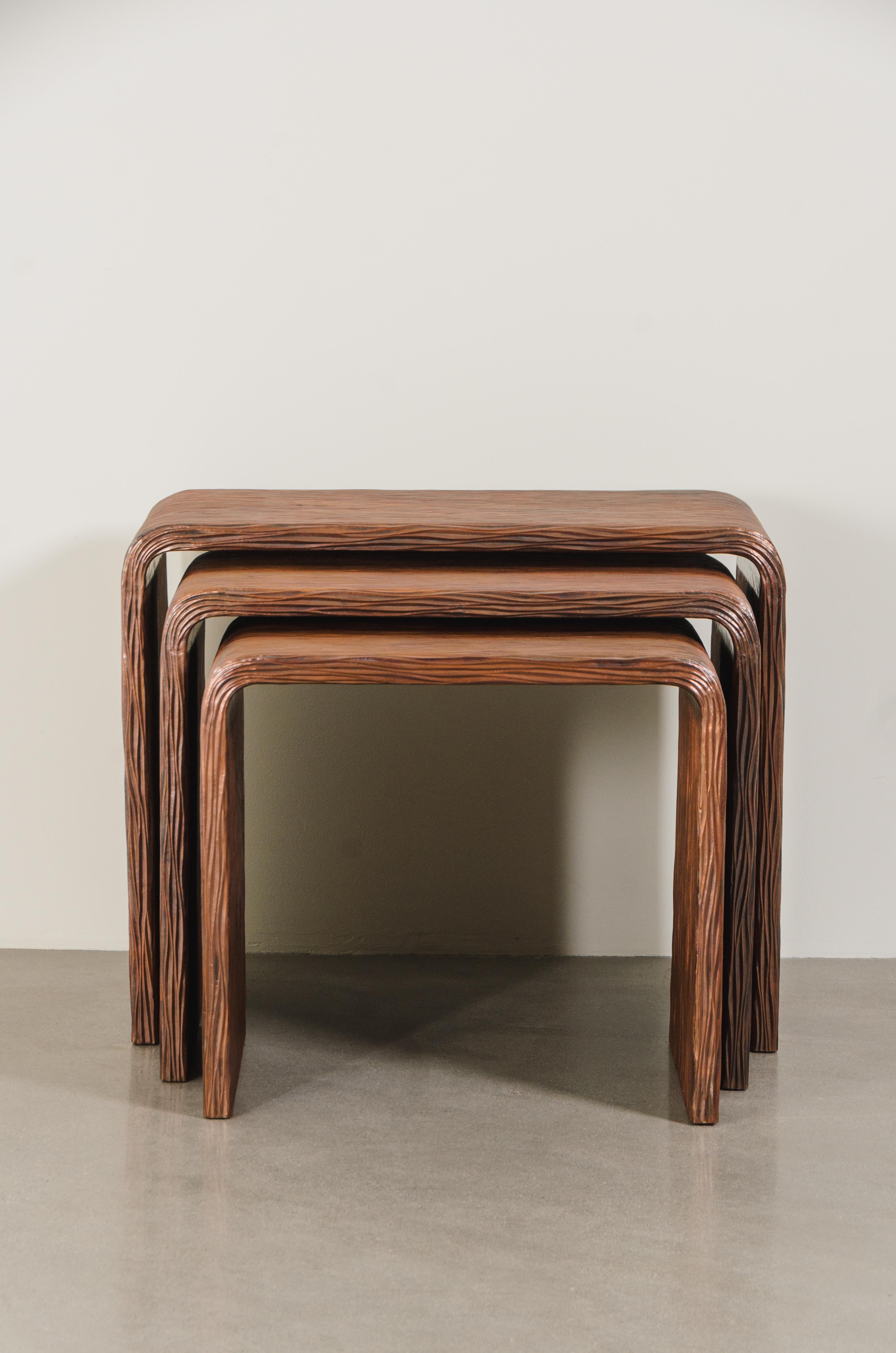 Pleats Design Copper Nesting Tables (Set of 3)
Antique Copper
Hand Repoussé
Limited Edition
Contemporary

NESTING TABLE MEASUREMENTS:
Large: 30.5