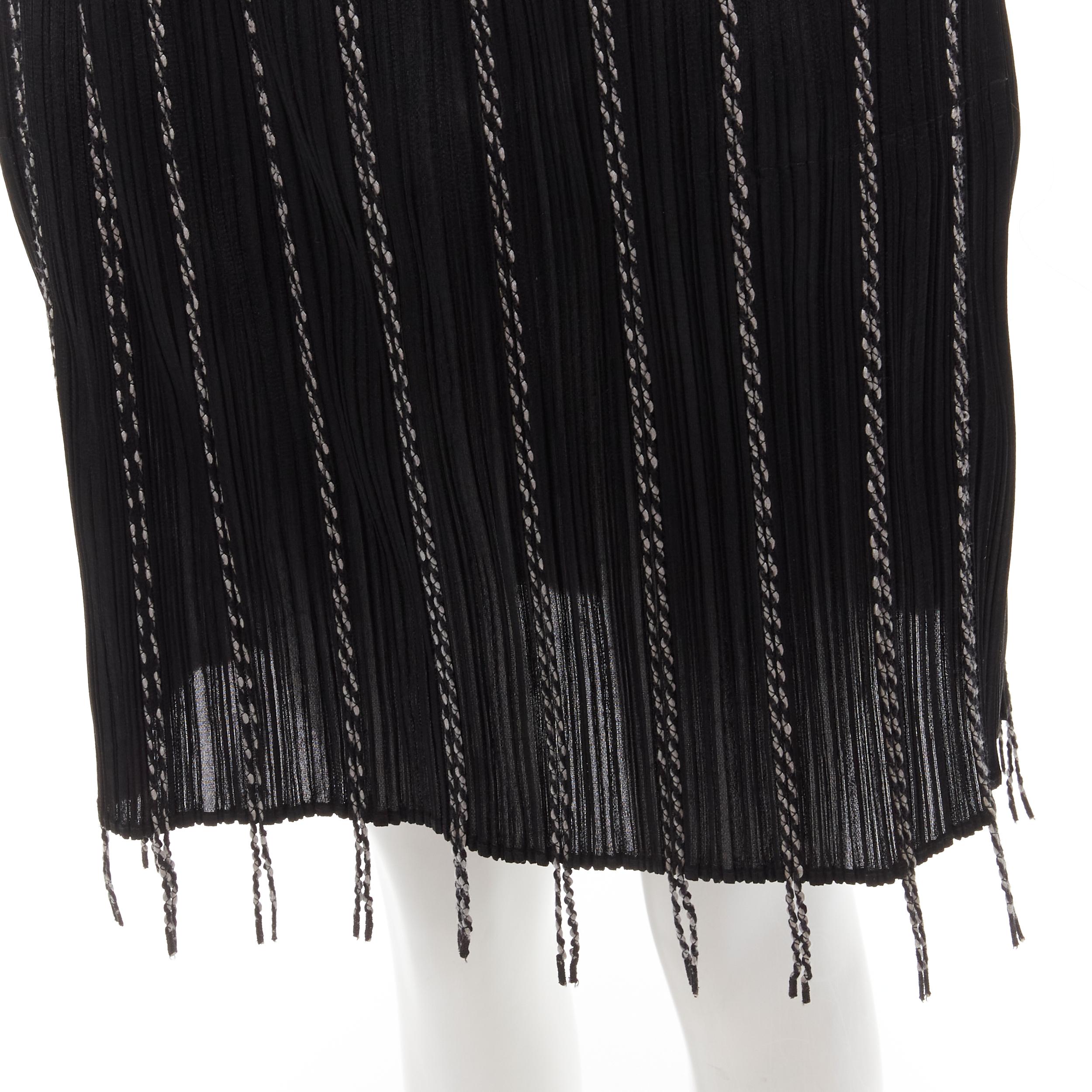 PLEATS PLEASE ISSEY MIYAKE black plisse pleated white fringe trim skirt JP3 L
Brand: Pleats Please Issey Miyake
Material: Polyester
Color: Black
Pattern: Solid
Extra Detail: Elasticated waist.
Made in: Japan

CONDITION:
Condition: Excellent, this