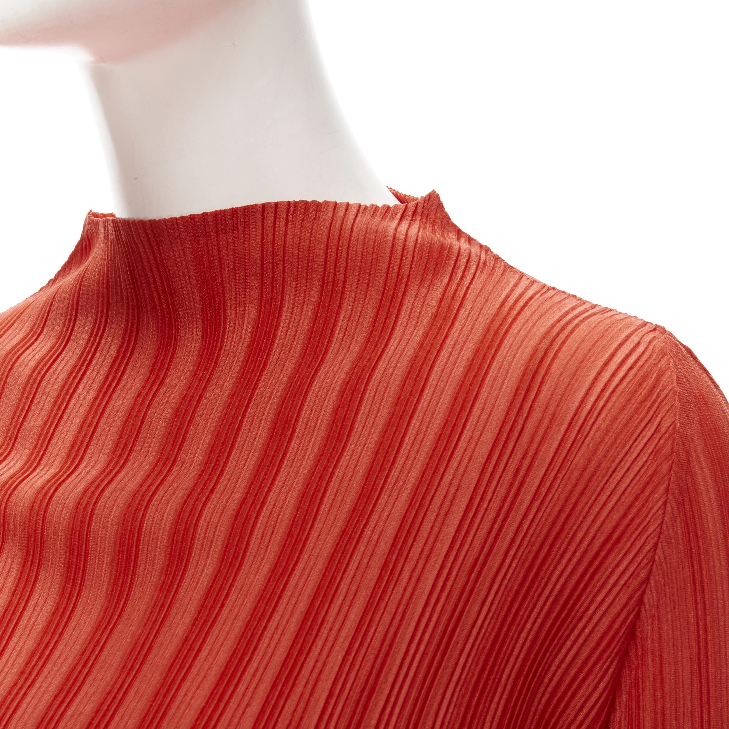 PLEATS PLEASE ISSEY MIYAKE burnt orange pleated plisse mock collar top JP3 L
Brand: Pleats Please Issey Miyake
Material: Polyester
Color: Tangerine Orange
Pattern: Solid
Made in: Japan

CONDITION:
Condition: Excellent, this item was pre-owned and is