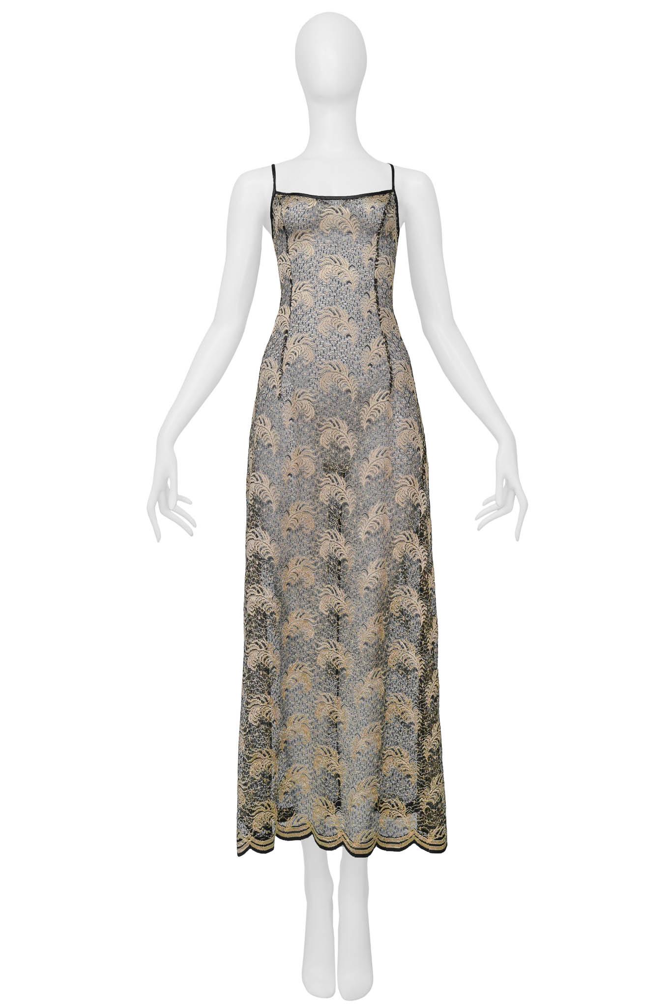 Resurrection Vintage is excited to present a vintage Plein Sud black and gold floral lace slip dress with an exposed back, satin ribbon ties, buttons, and maxi length. 

Plein Sud 
Size: 38
Polyester and Viscose
Lace & Satin Ribbon  
Excellent