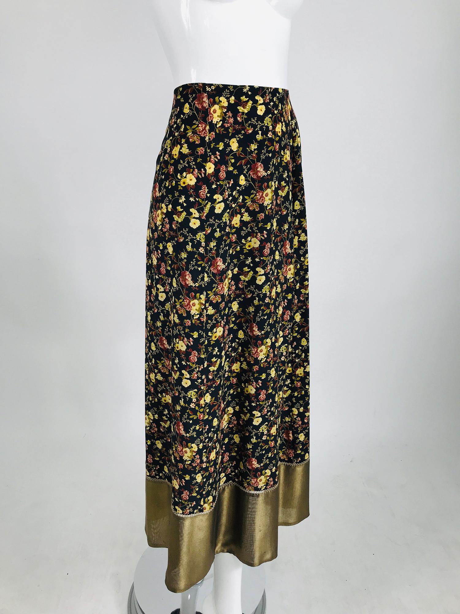 Plein Sud floral silk praire skirt with gold hem. Maxi skirt in a beautiful floral print with a gold silk hem that is attached with embroidery. Gored A linedskirt. Unlined. The skirt adjusts with draw self ribbons at the skirt waist back. Marked