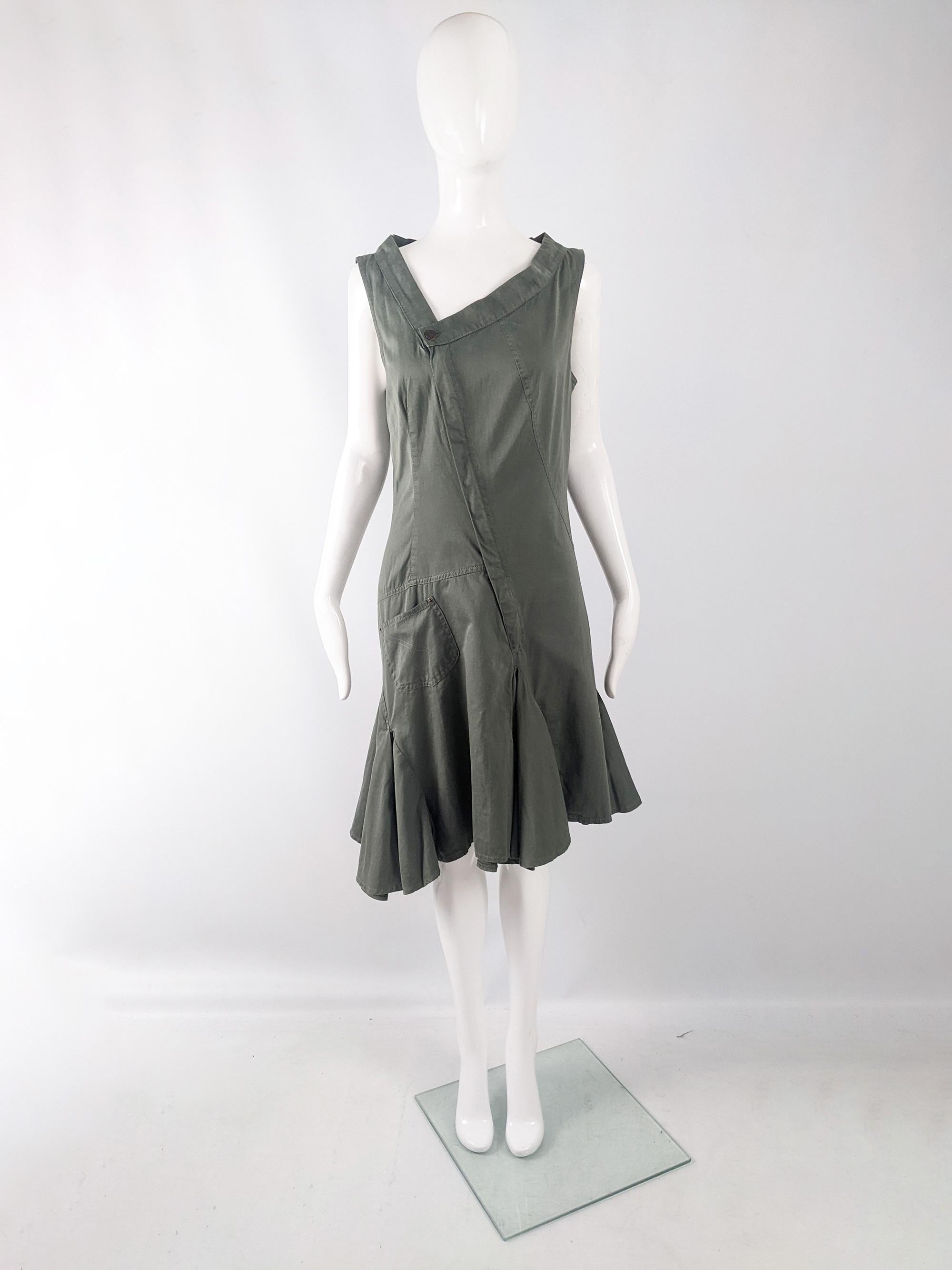 An amazing and avant garde vintage womens dress from the 90s by luxury fashion house Plein Sud for the Plein Sud Jeans line. In a green khaki cotton fabric with an asymmetrical look and a unique silhouette. It has a wide, off-centre neckline that