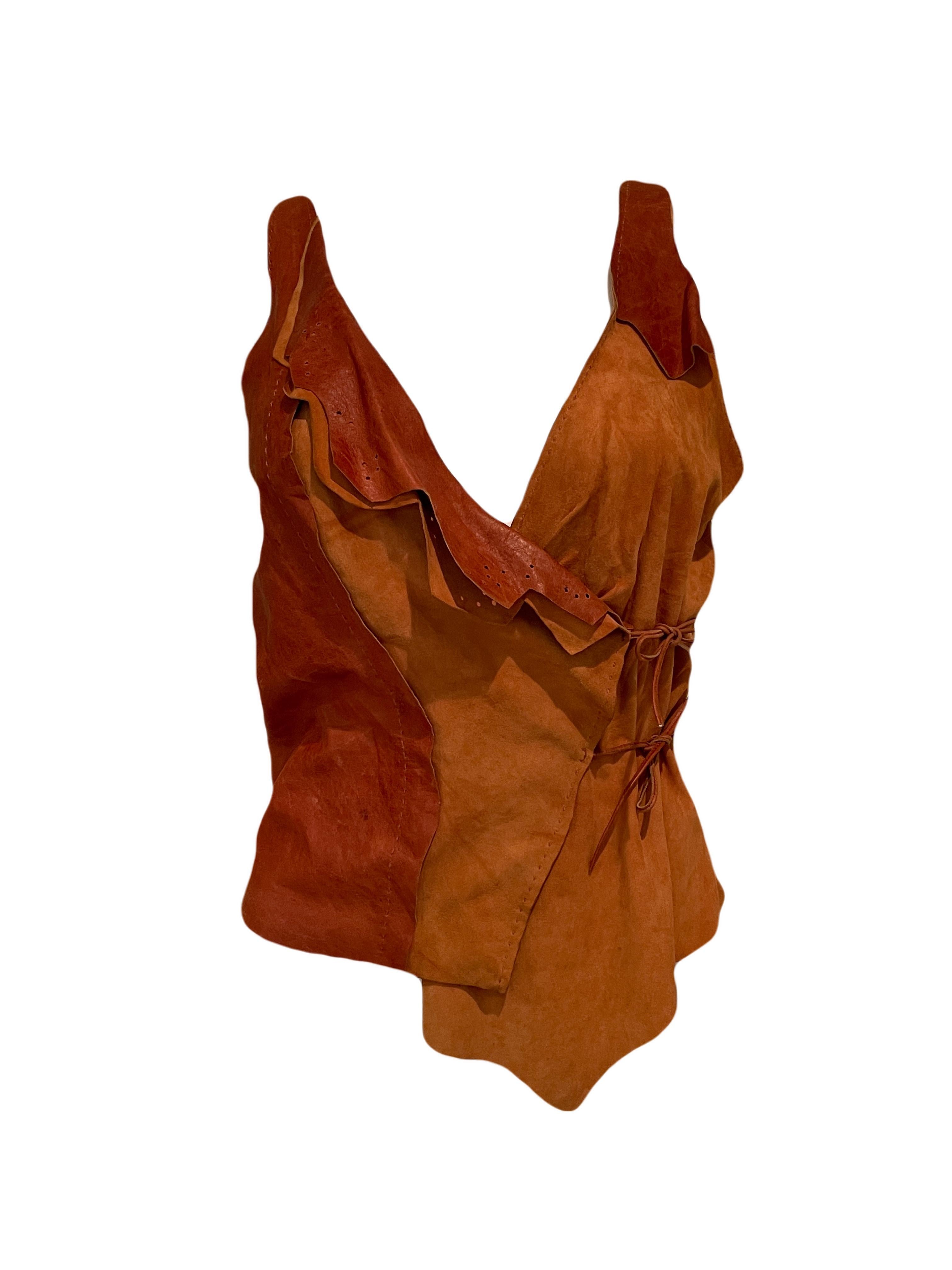 Vintage Plein Sud leather vest in excellent vintage condition. This brownish red orange vest can fit sizes XS - L. SEXY!!

Returns are only available to European customers per the law.